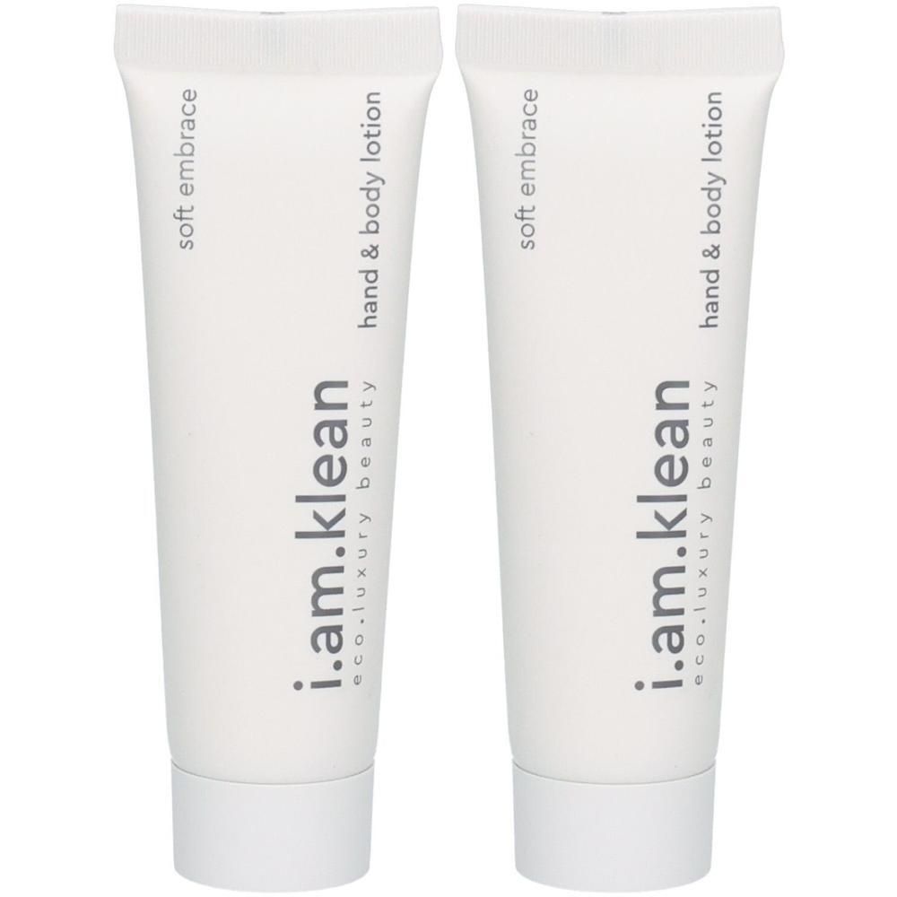 Deux tubes blancs de lotion pour les mains et le corps "i.am.klean" et "soft embrace".