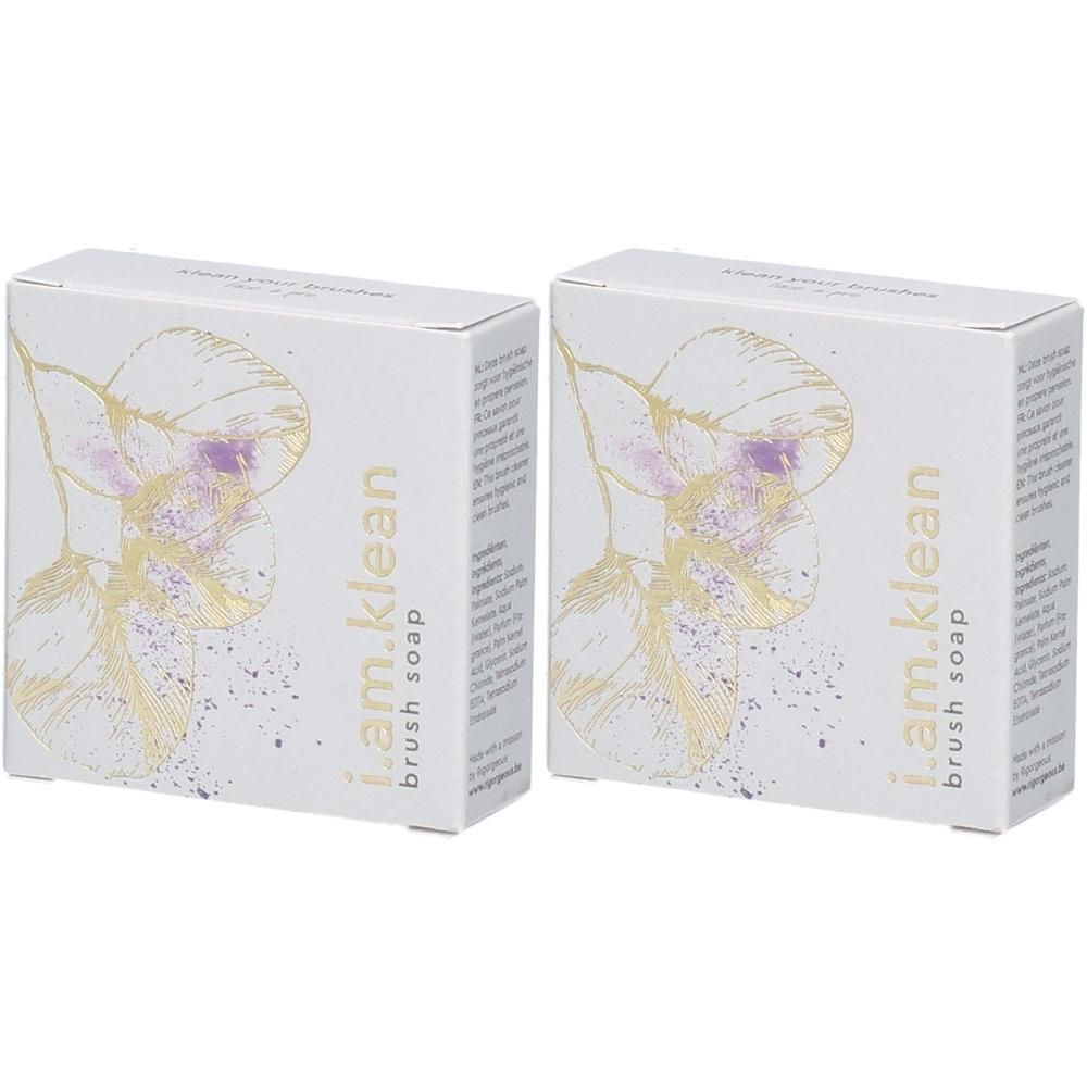 Deux boîtes de savon pour pinceaux i.am.klean avec un design floral.