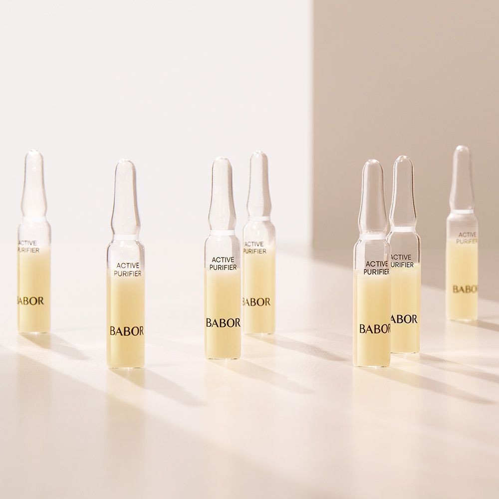 Plusieurs ampoules BABOR Active Purifier sur une surface claire.