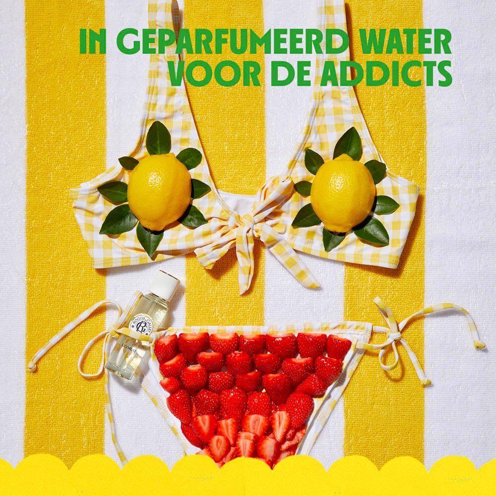 Vrouw drinkt een drankje met citroen, opschrift "House of Happiness".