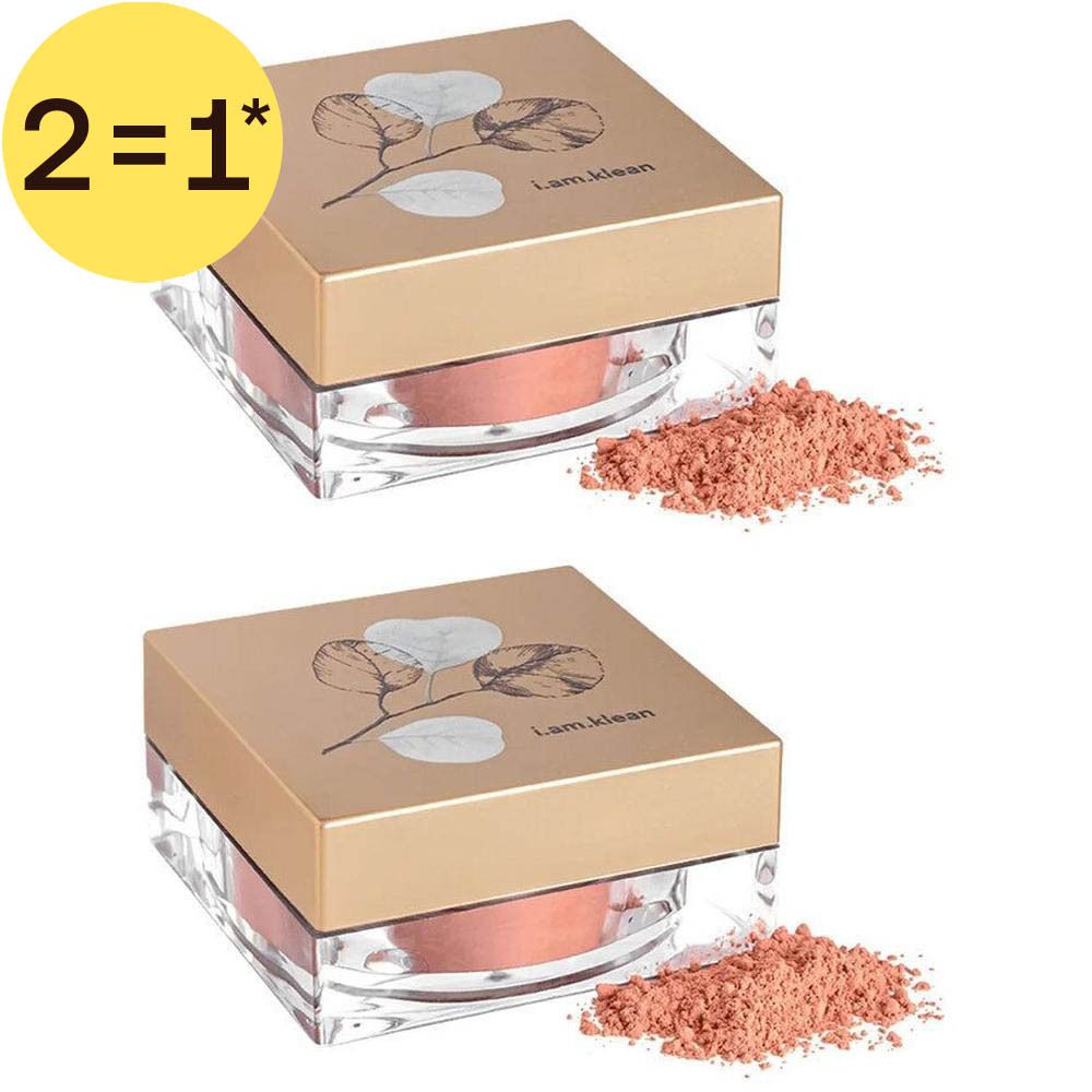 Twee potjes los blush poeder in perzikkleur. Gouden deksel met bladerenmotief.