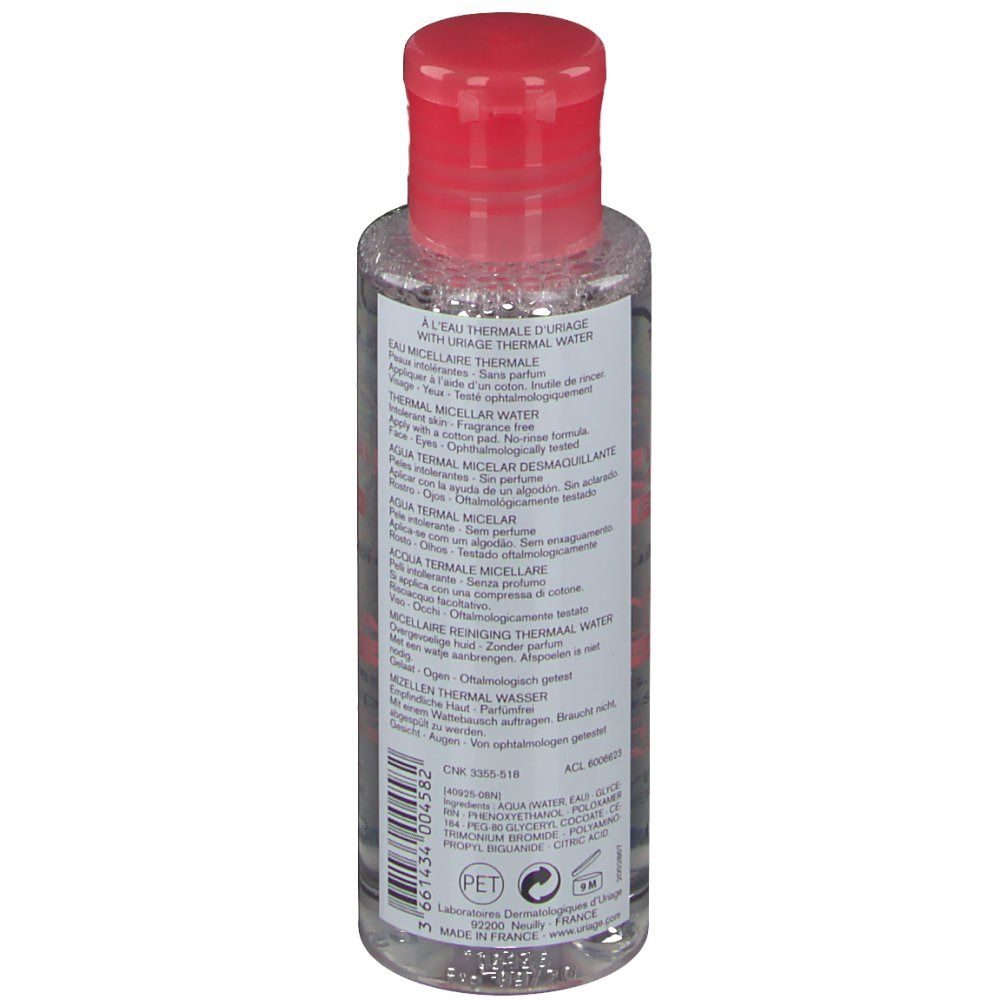 Dos du flacon avec bouchon rouge. Informations produit multilingues. Symbole de recyclage PET.