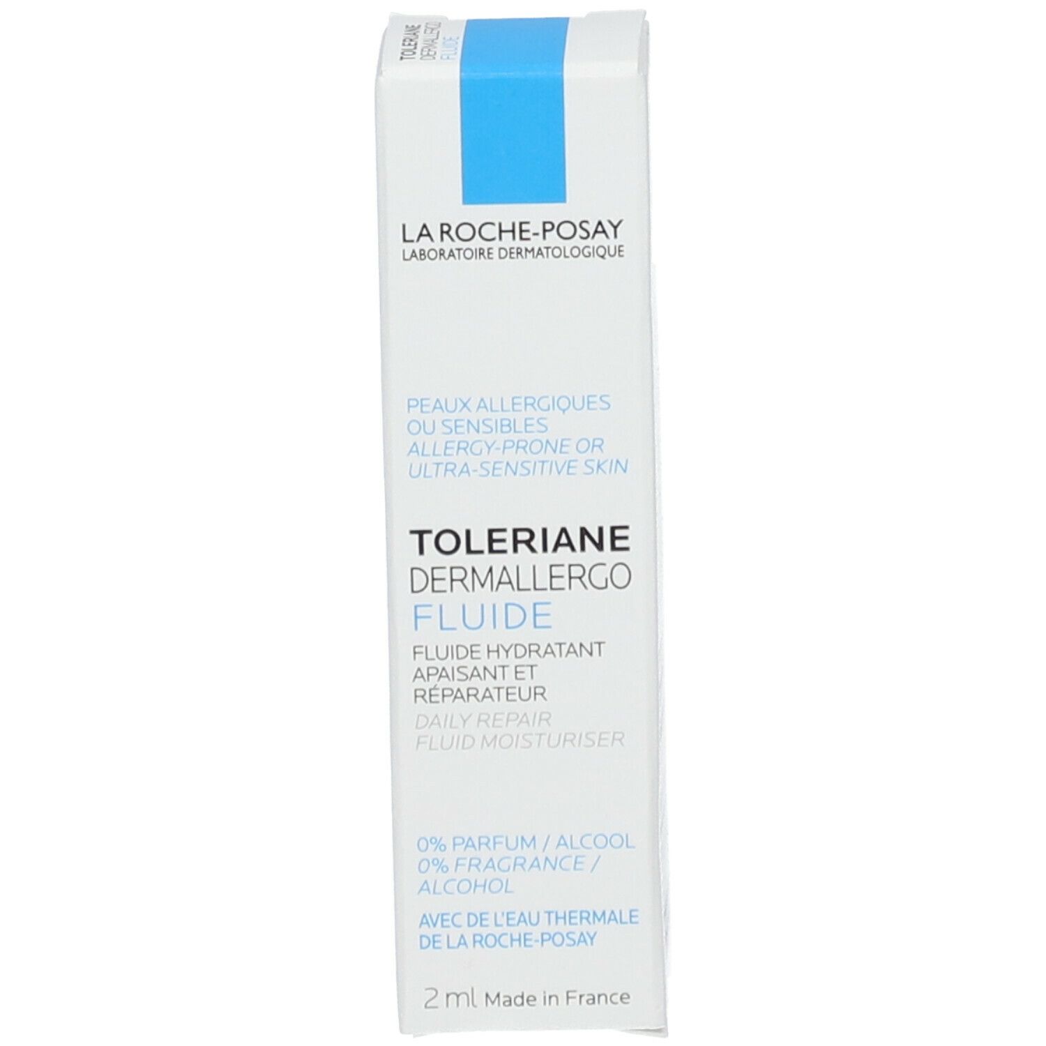 Witte en blauwe kartonnen verpakking. Tekst: Toleriane Dermallergo Fluide, La Roche-Posay. Voor allergische of gevoelige huid. 2 ml.