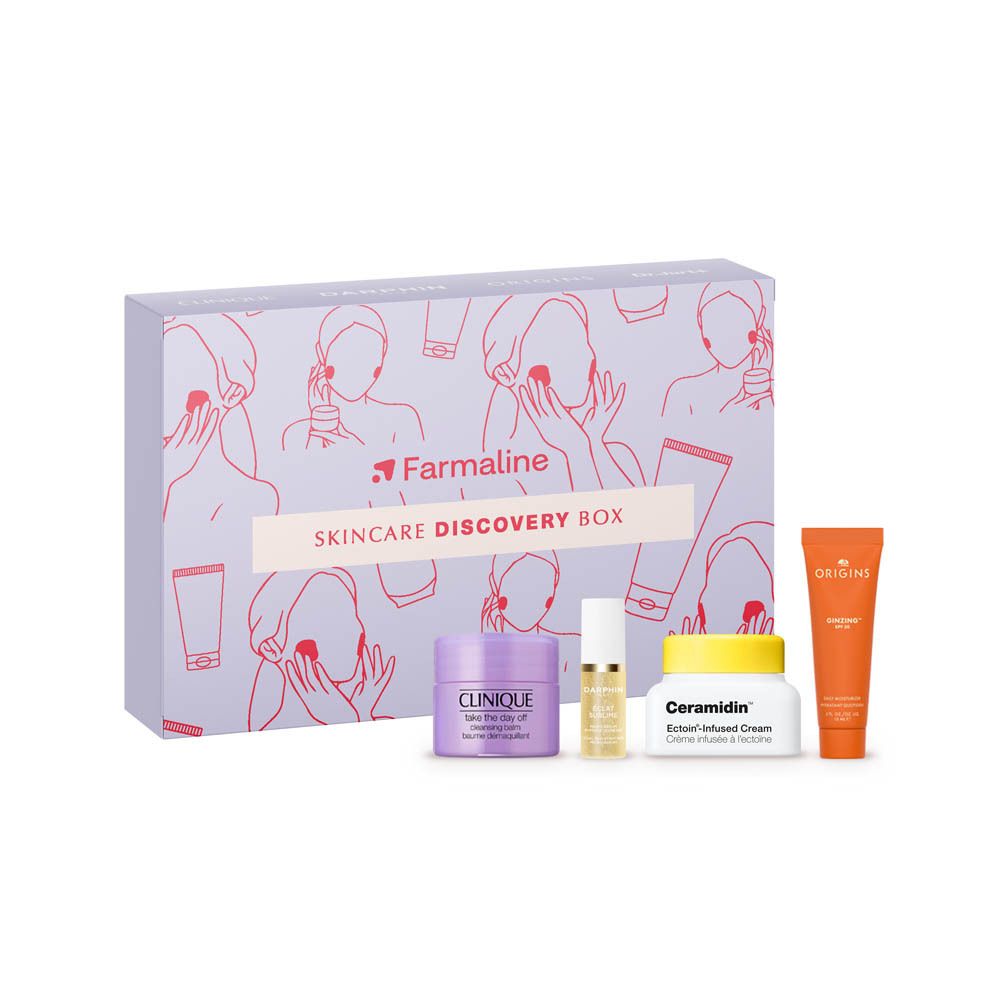Coffret Skincare Discovery Box avec produits. Boîte imprimée, crèmes et flacons à côté.