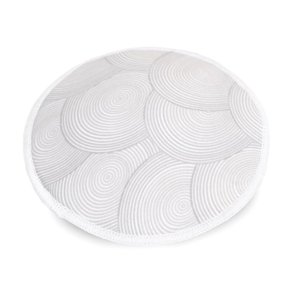 Coussinet d'allaitement blanc rond avec motif en spirale. Le bord est bordé de tissu blanc.