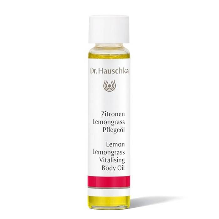 Flesje lichaamsolie met witte dop. Opschrift: Dr. Hauschka, Zitrone, Lemongrass, Pflegeöl, Lemon, Lemongrass, Vitalising Body Oil.