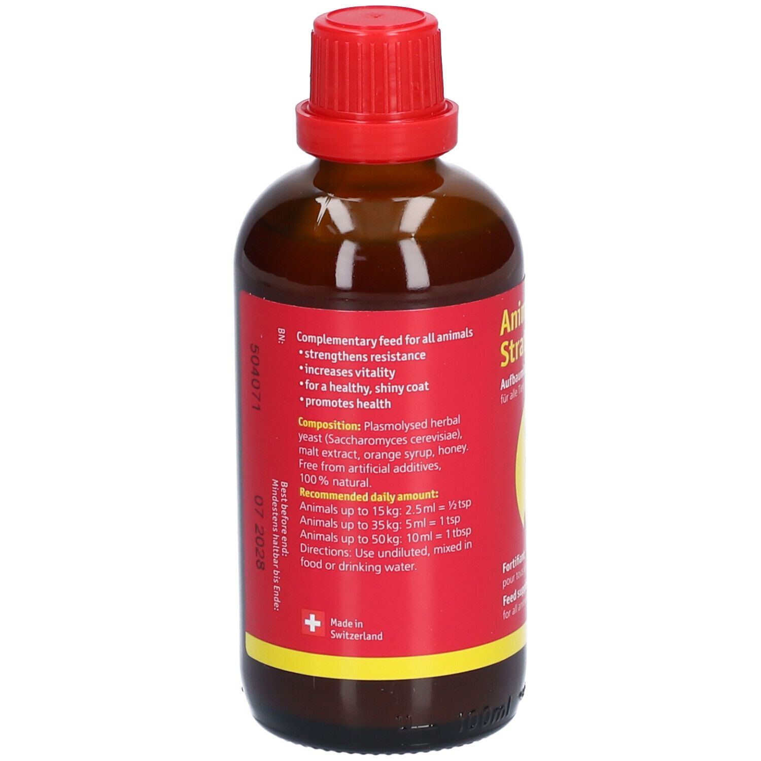 Bruine glazen fles met rode dop. Rood etiket met tekst. Bevat informatie over samenstelling en dosering.