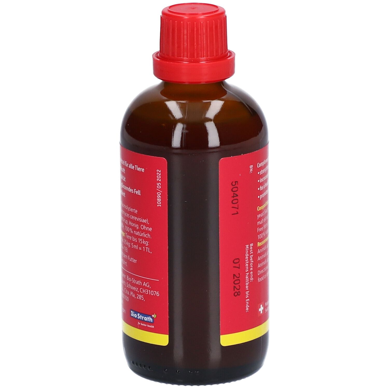 Bruine glazen fles met rode dop. Rood etiket met tekst. Bevat informatie over samenstelling en dosering.