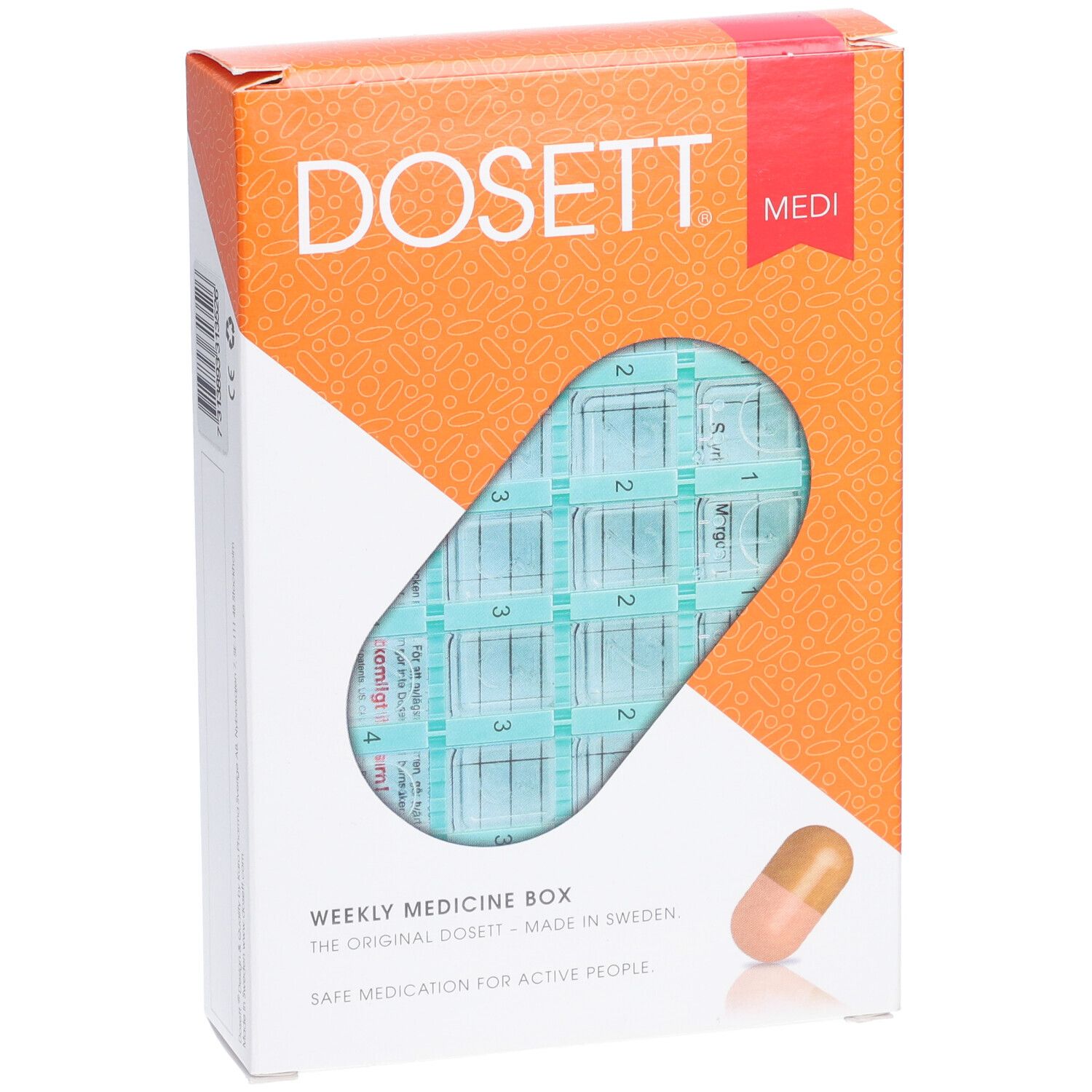 Boîte à pilules dans son emballage. Visible : DOSETT, Medi. Boîte hebdomadaire avec compartiments. Emballage orange et blanc. Icône de pilule.