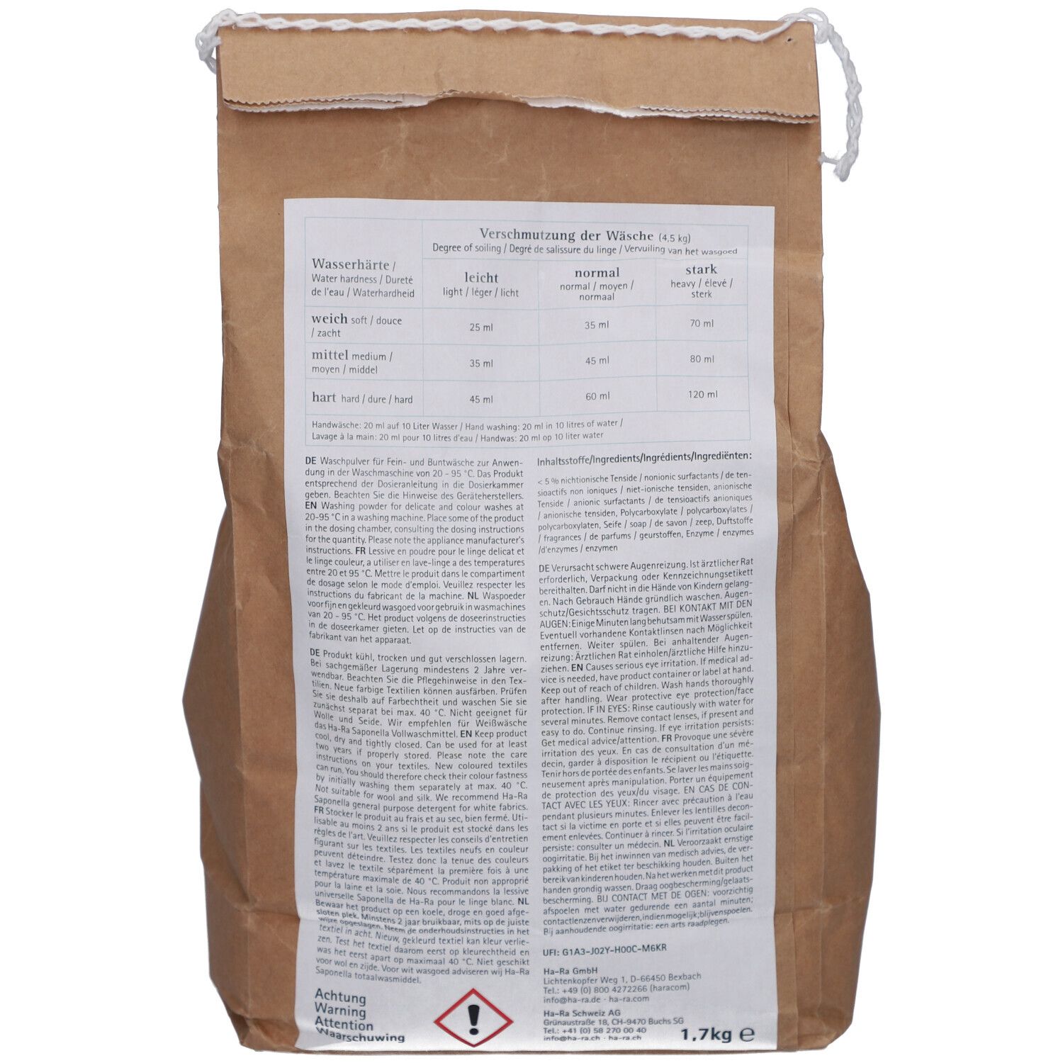 Achterkant van een bruine papieren zak. Tekst in het Duits, Frans, Italiaans en Nederlands. Bevat doseertabellen en waarschuwingen.