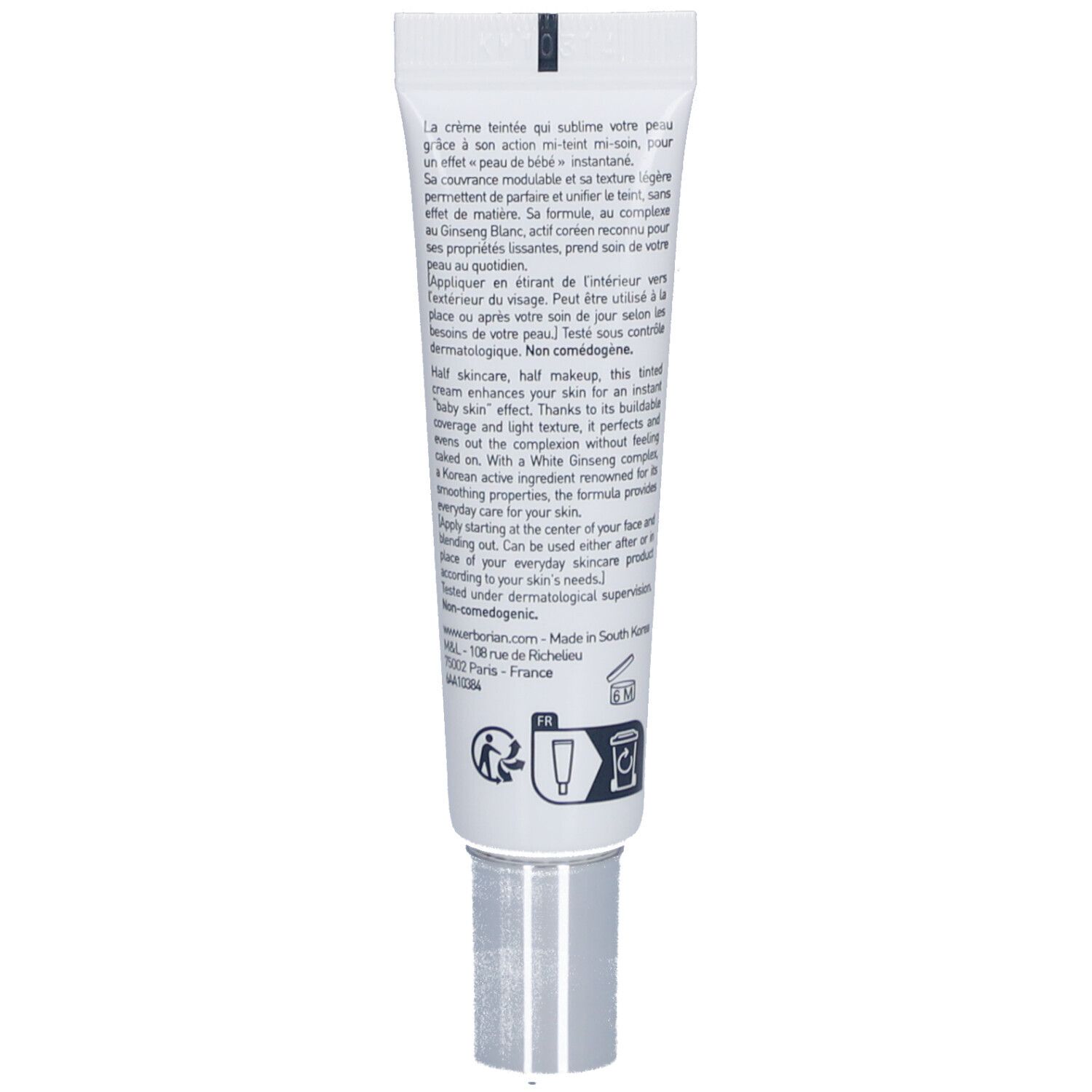 Tube blanc avec bouchon argenté et texte multilingue, incluant instructions et symboles.