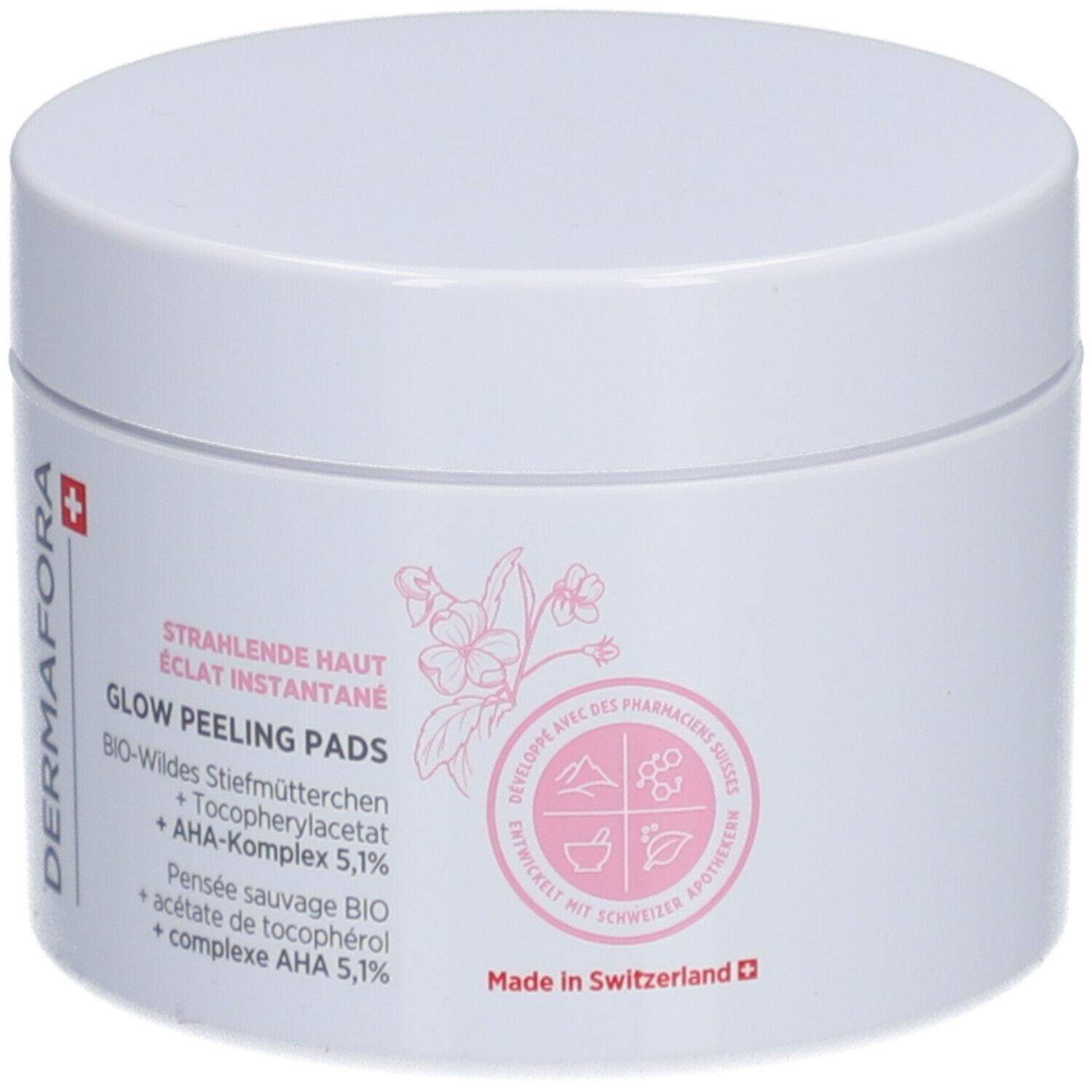 Witte pot met roze opdruk. Opschrift: Dermafora, Glow Peeling Pads. Met Zwitsers kruis.
