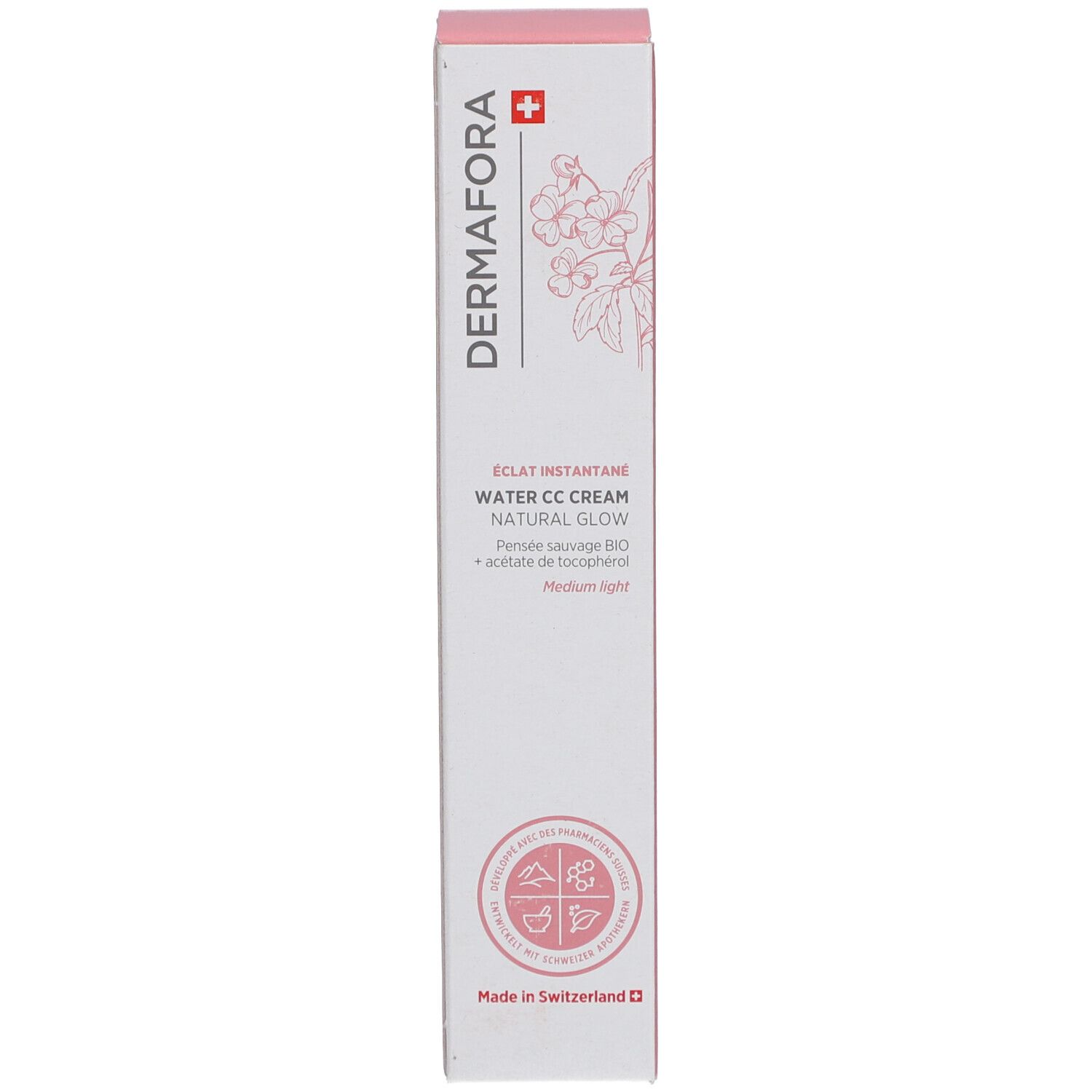 Doos met roze accenten. Opschrift: Dermafora, Water CC Cream Natural Glow. Zwitsers kruis en bloemenmotief.