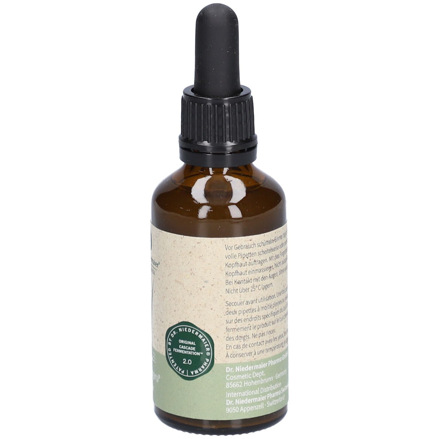 Bruine glazen fles met zwarte druppelaar. Etiket met tekst, logo en certificering. Productnaam: Regulatpro Hair.