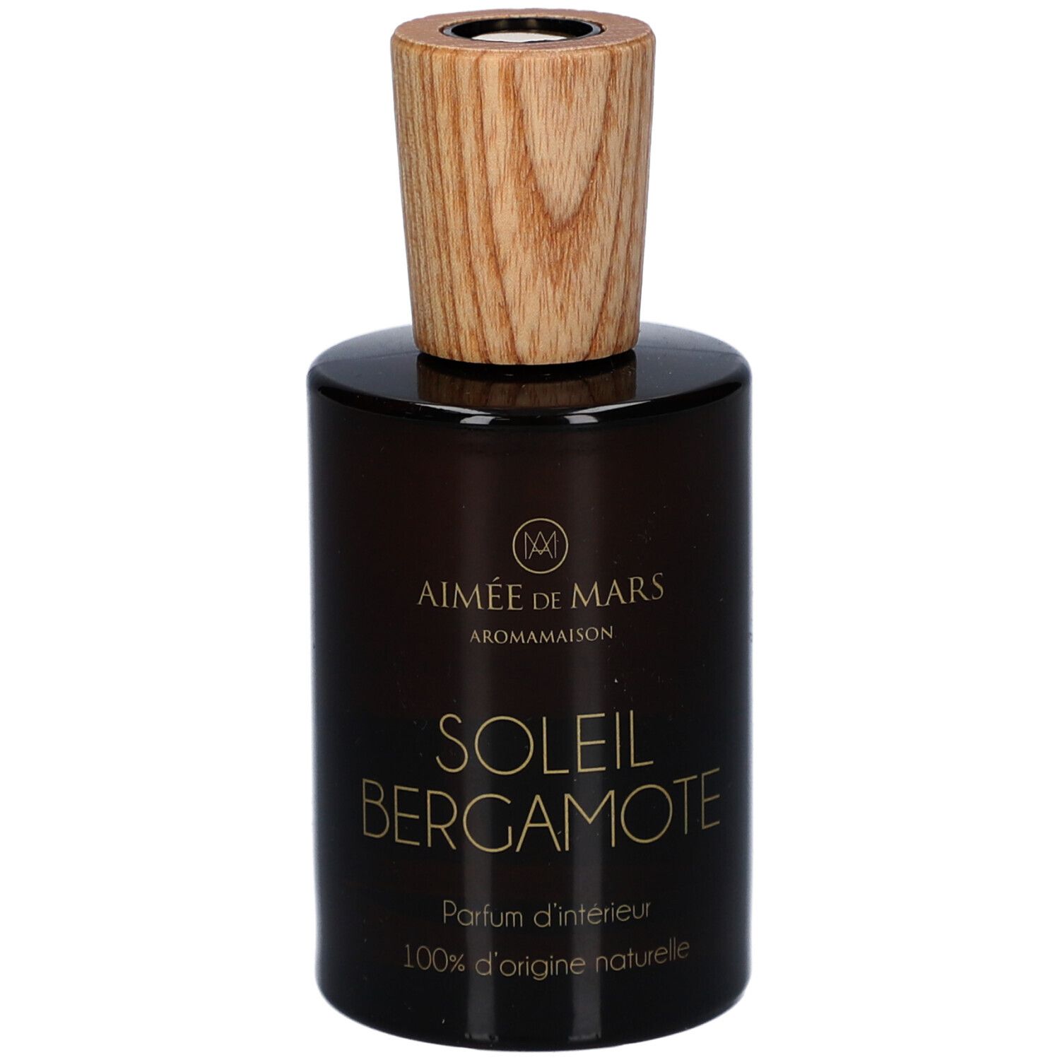 Bruine glazen fles met houten dop. Opschrift: AIMEE DE MARS, SOLEIL BERGAMOTE, Parfum d'intérieur, 100% d'origine naturelle.
