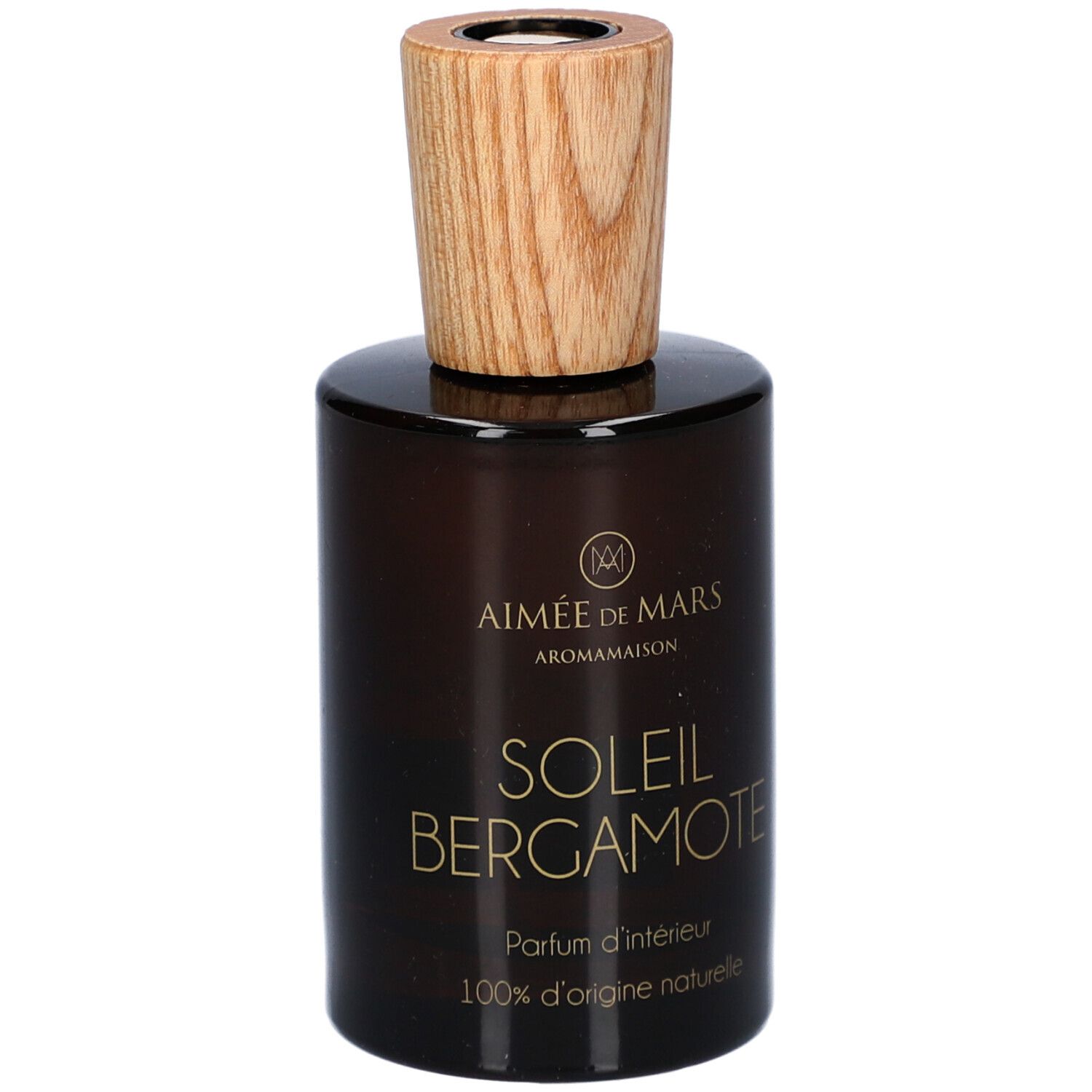 Bruine glazen fles met houten dop. Opschrift: AIMEE DE MARS, SOLEIL BERGAMOTE, Parfum d'intérieur, 100% d'origine naturelle.