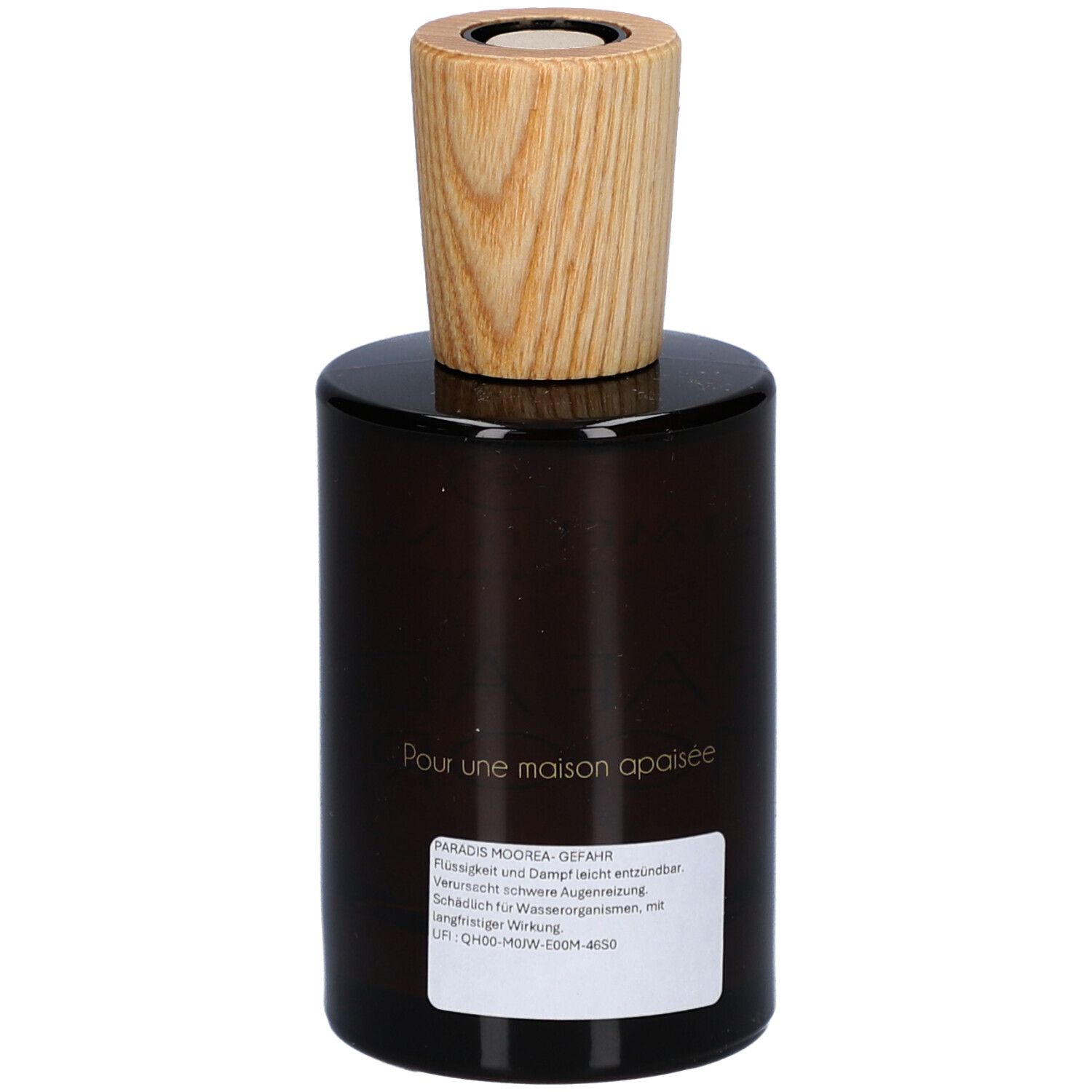 Bruine glazen fles met houten dop. Etiket met tekst. Opschrift: Pour une maison apaisée.