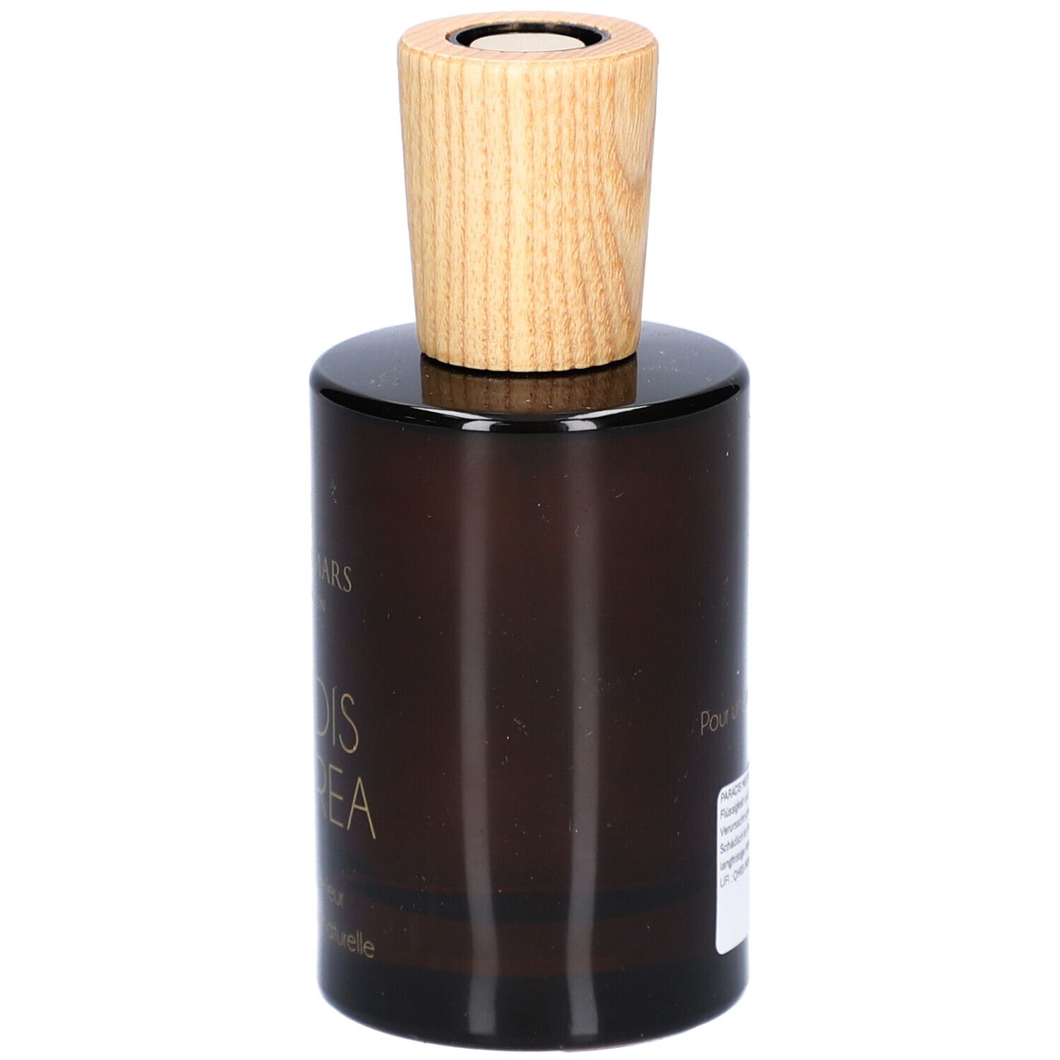 Bruine glazen fles met houten dop. Opschrift: Paradis Moorea, Parfum d'intérieur, 100% d'origine naturelle. Merk: Aimée de Mars.