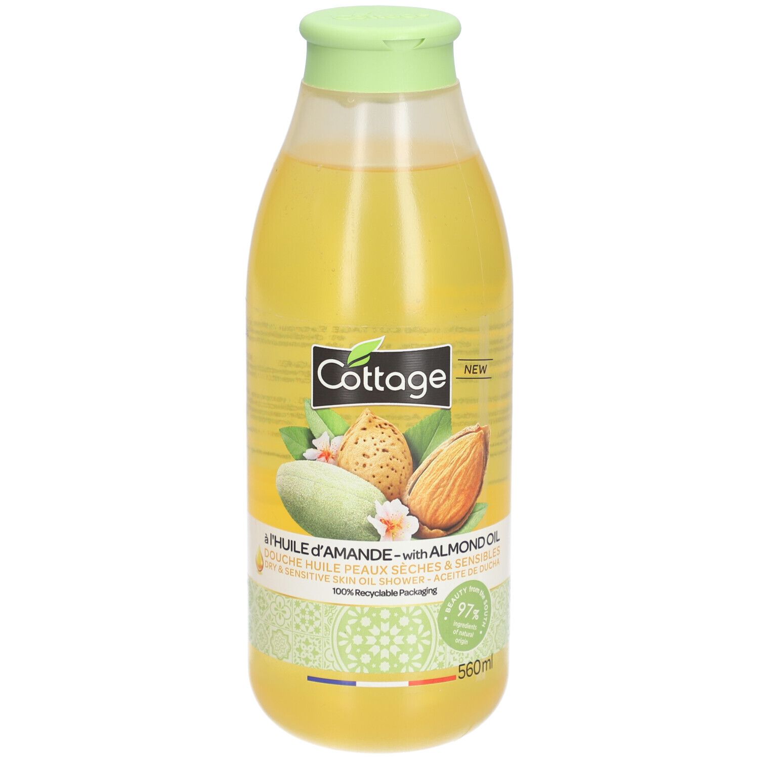 Flacon de douche Cottage à l'huile d'amande. Liquide jaune. Illustrations d'amandes. Bouchon vert. 560ml. Emballage recyclable.