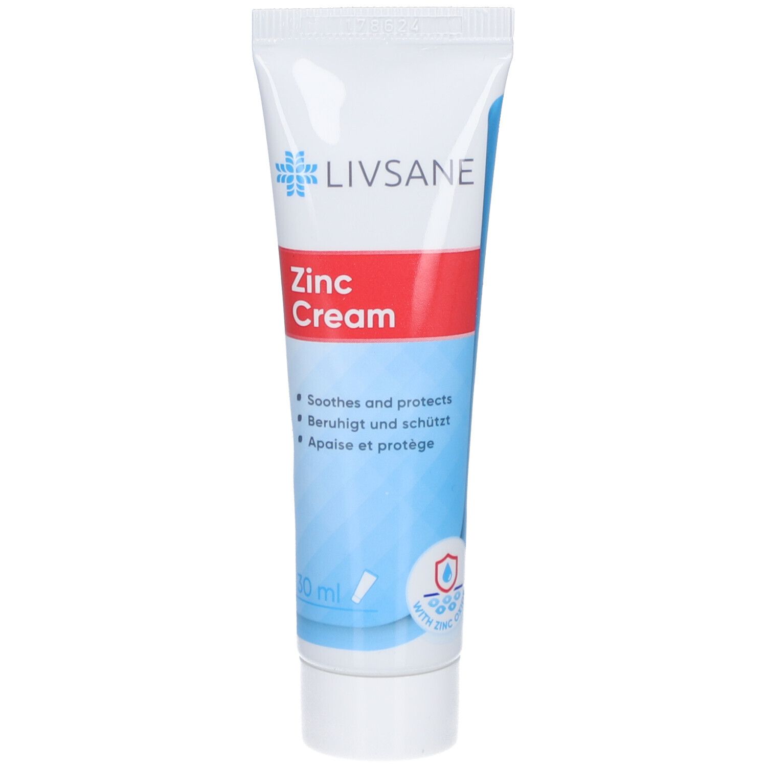 Tube de crème au zinc LIVSANE. Blanc, bleu et rouge. Contient de l'oxyde de zinc. Texte : Soothes and protects, Beruhigt und schützt, Apaise et protège.