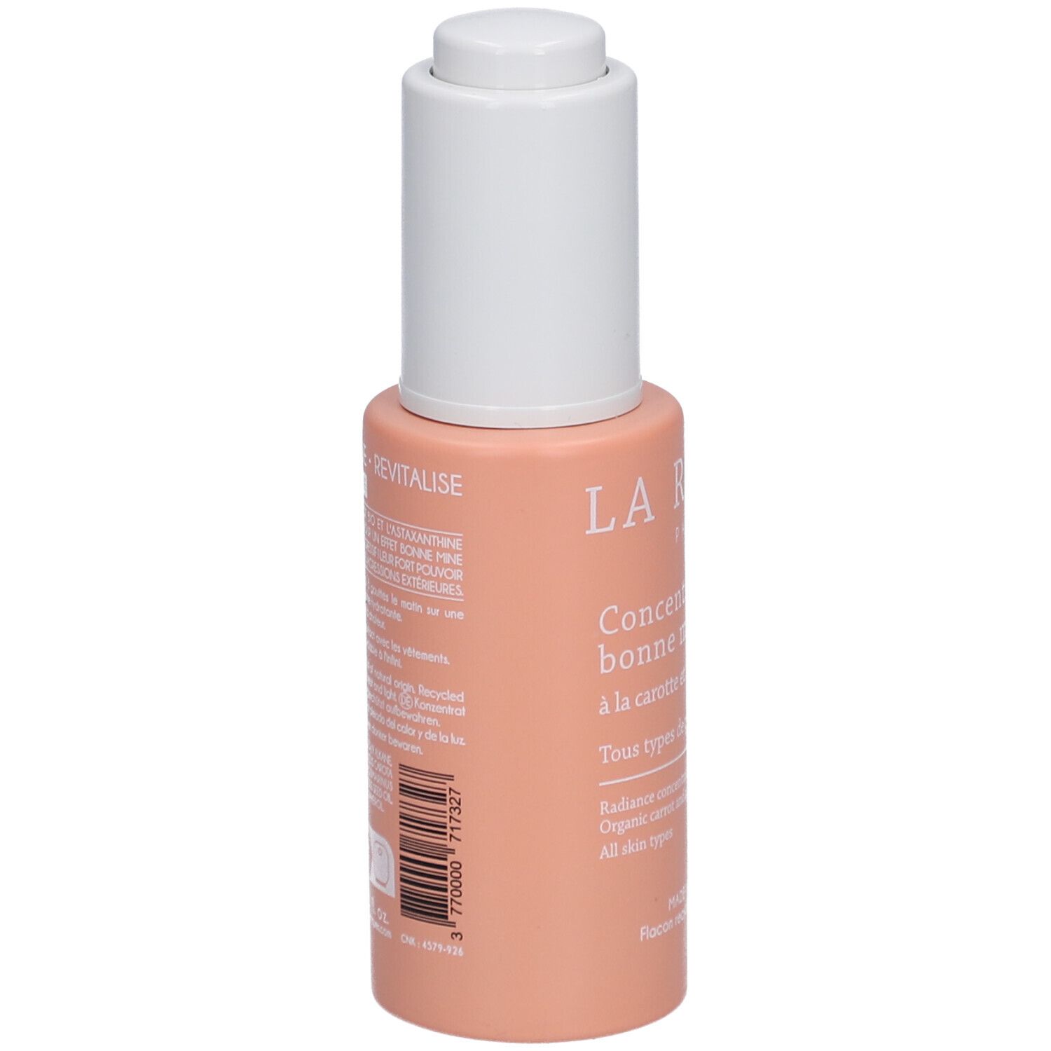 Achterkant van een roze fles met witte dop. Tekst: Ingrediënten, gebruiksaanwijzing, fabrikantinfo. 3 770000 777327.