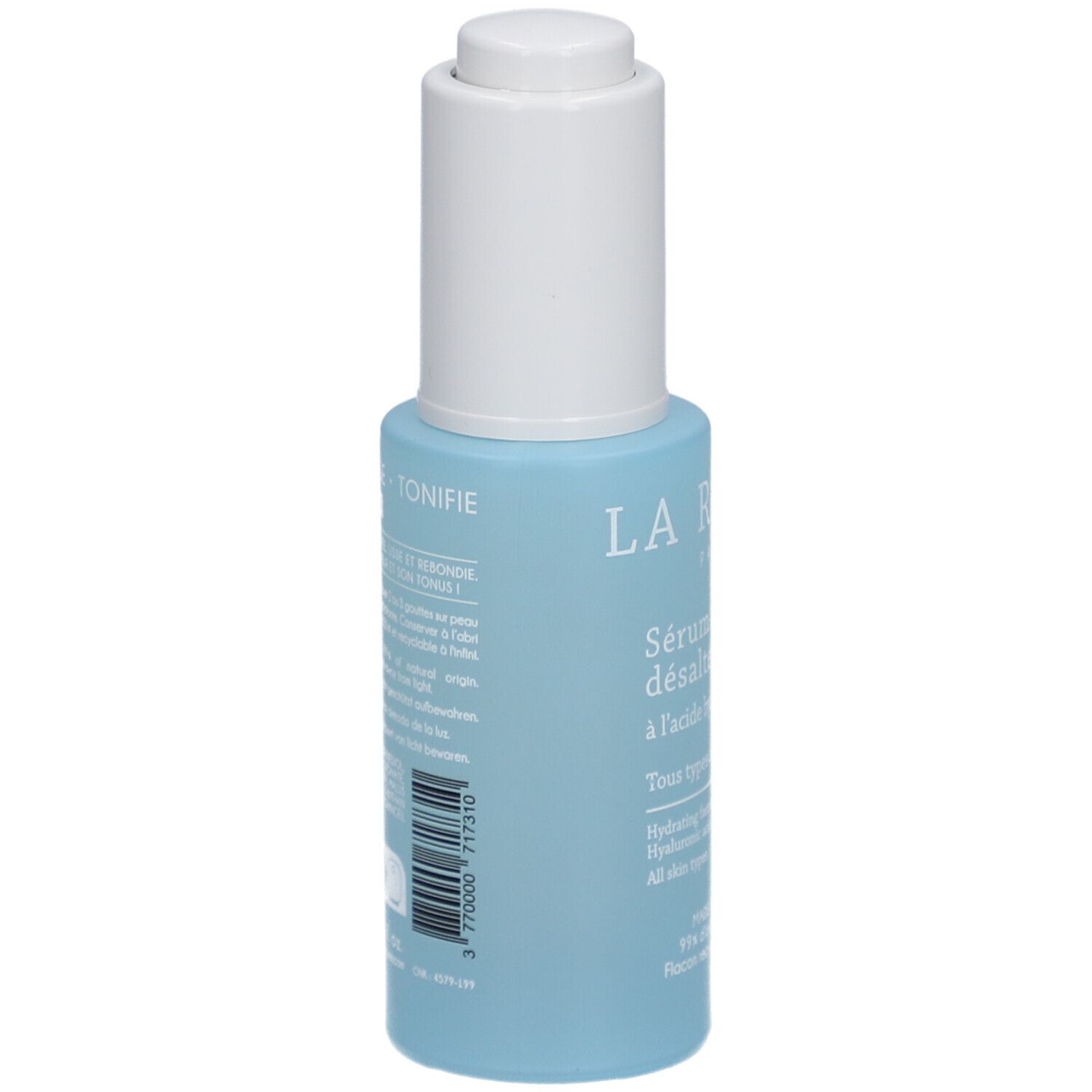Lichtblauwe fles met witte dop. Opschrift: La Rosée, Sérum visage désaltérant. Achterkant met productinformatie en barcode.