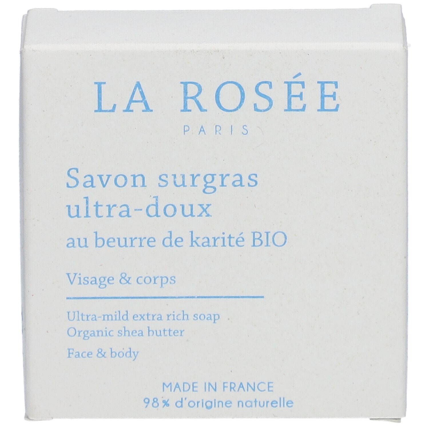Witte verpakking met blauwe tekst. Bevat 'LA ROSÉE PARIS', 'Savon surgras ultra-doux', 'Visage & corps' en '98% d'origine naturelle'.