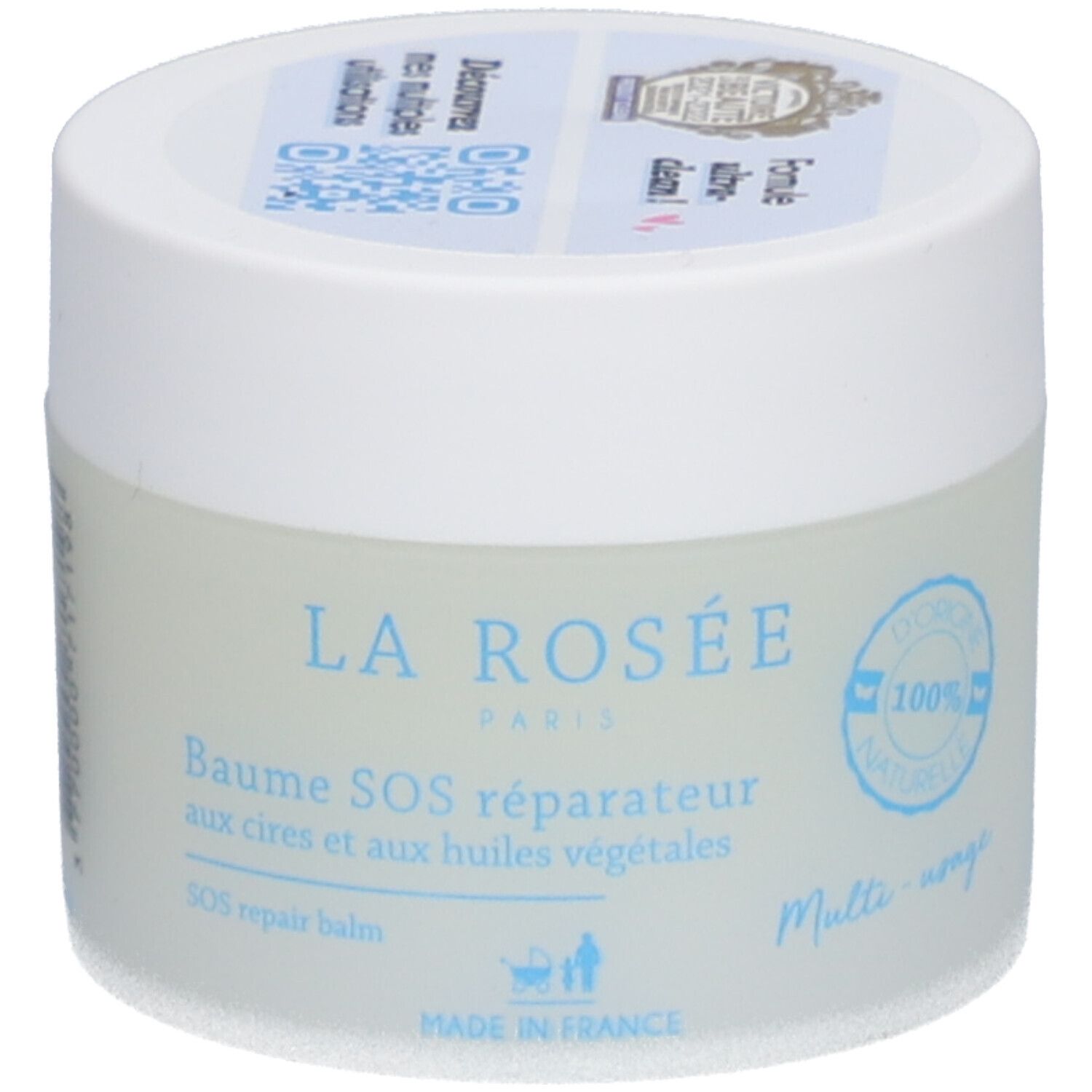 Ronde pot met witte deksel. Opschrift: LA ROSÉE, Baume SOS réparateur. Blauwe tekst op lichtblauwe achtergrond. 100% naturelle.