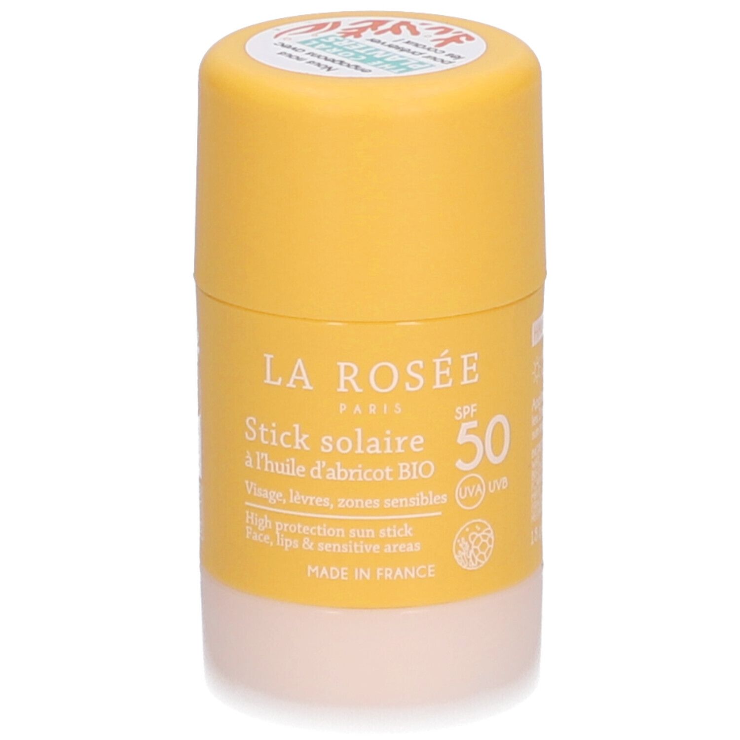 Stick solaire La Rosée SPF 50. Bâton jaune avec base blanche. Inscription: Stick solaire, à l'huile d'abricot BIO.