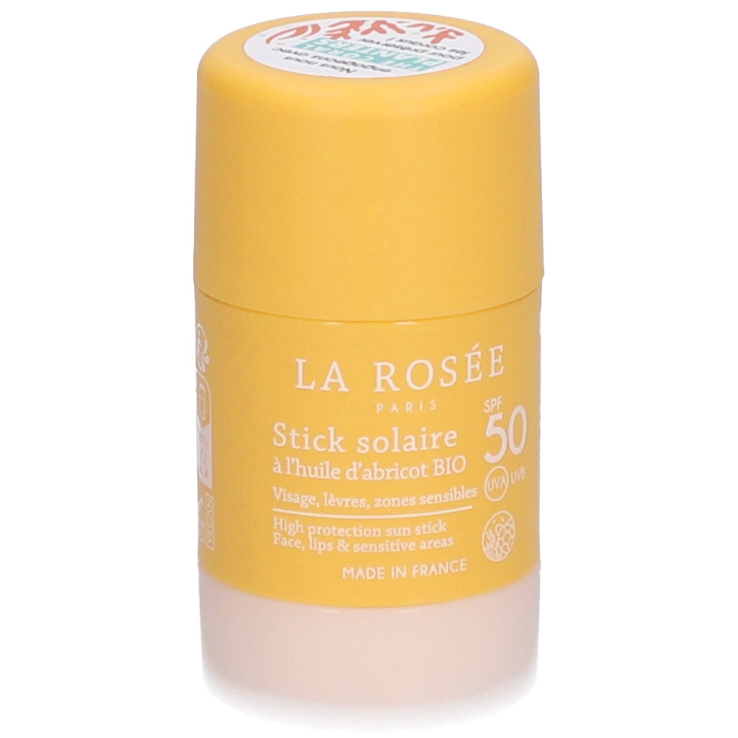 Stick solaire La Rosée SPF 50. Bâton jaune avec base blanche. Inscription: Stick solaire, à l'huile d'abricot BIO.