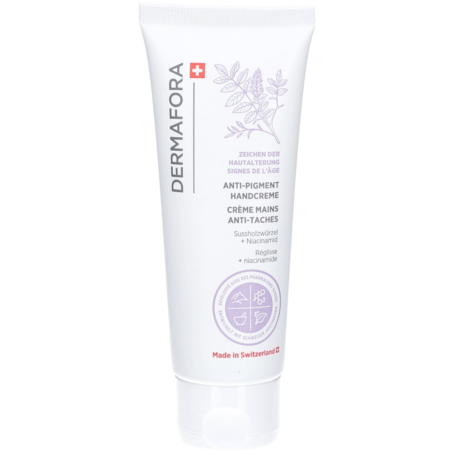 Tube blanc avec nom du produit et illustration florale. Texte: Crème mains anti-taches. Fabriqué en Suisse.