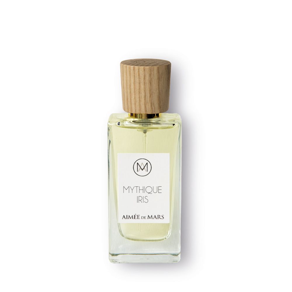 Flacon de parfum avec bouchon en bois. L'étiquette indique "Mythique Iris" et "Aimée de Mars".