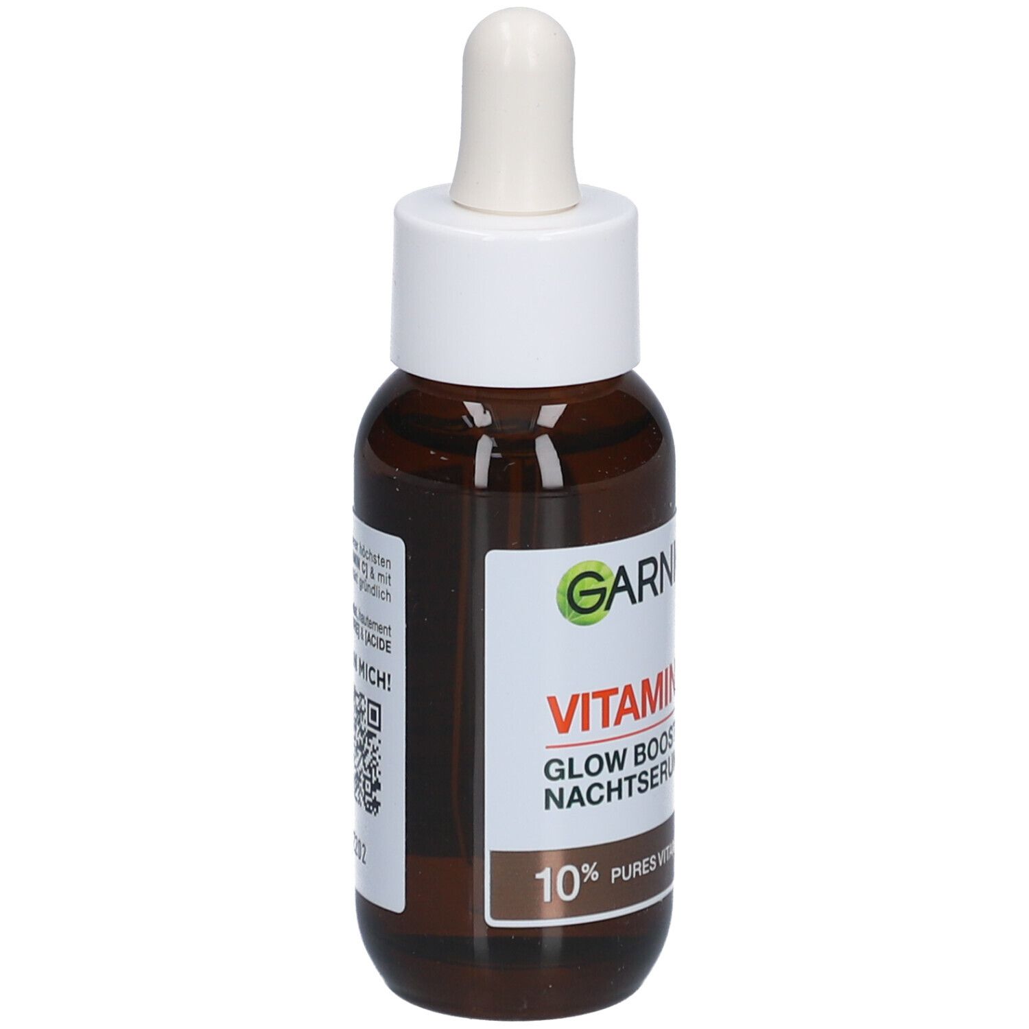 Bruine glazen fles met witte dop en pipet. Etiket met productnaam en inhoudsindicatie. Merk Garnier zichtbaar.