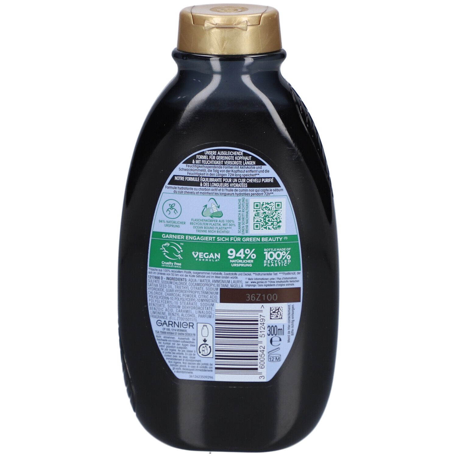 Achterkant van de shampoo fles. Tekst: GARNIER, Vegan, 94% van natuurlijke oorsprong, 100% gerecycled plastic. QR-code en barcode.