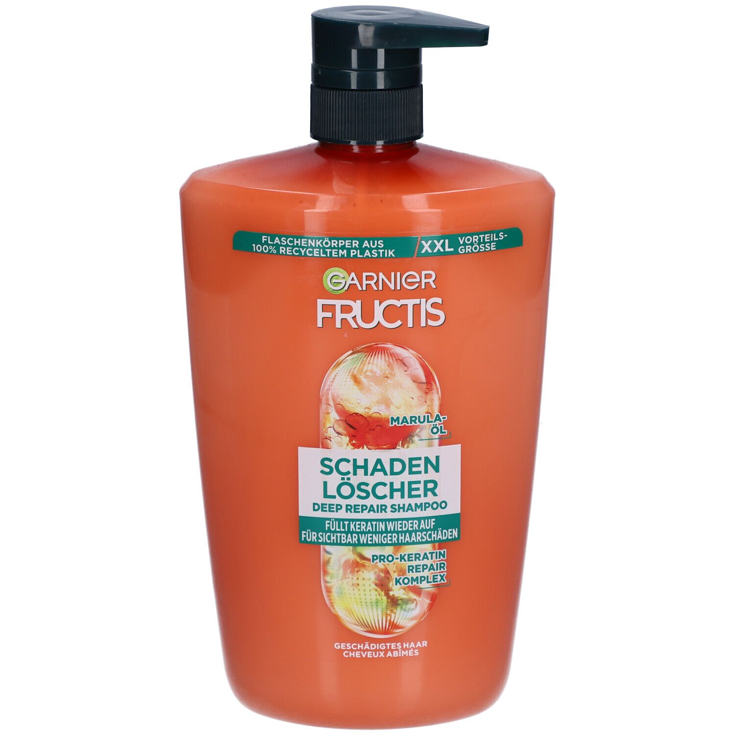 Oranje shampoo fles met zwarte pomp. Opschrift: Garnier Fructis, Schadenlöscher, Marula Oil.