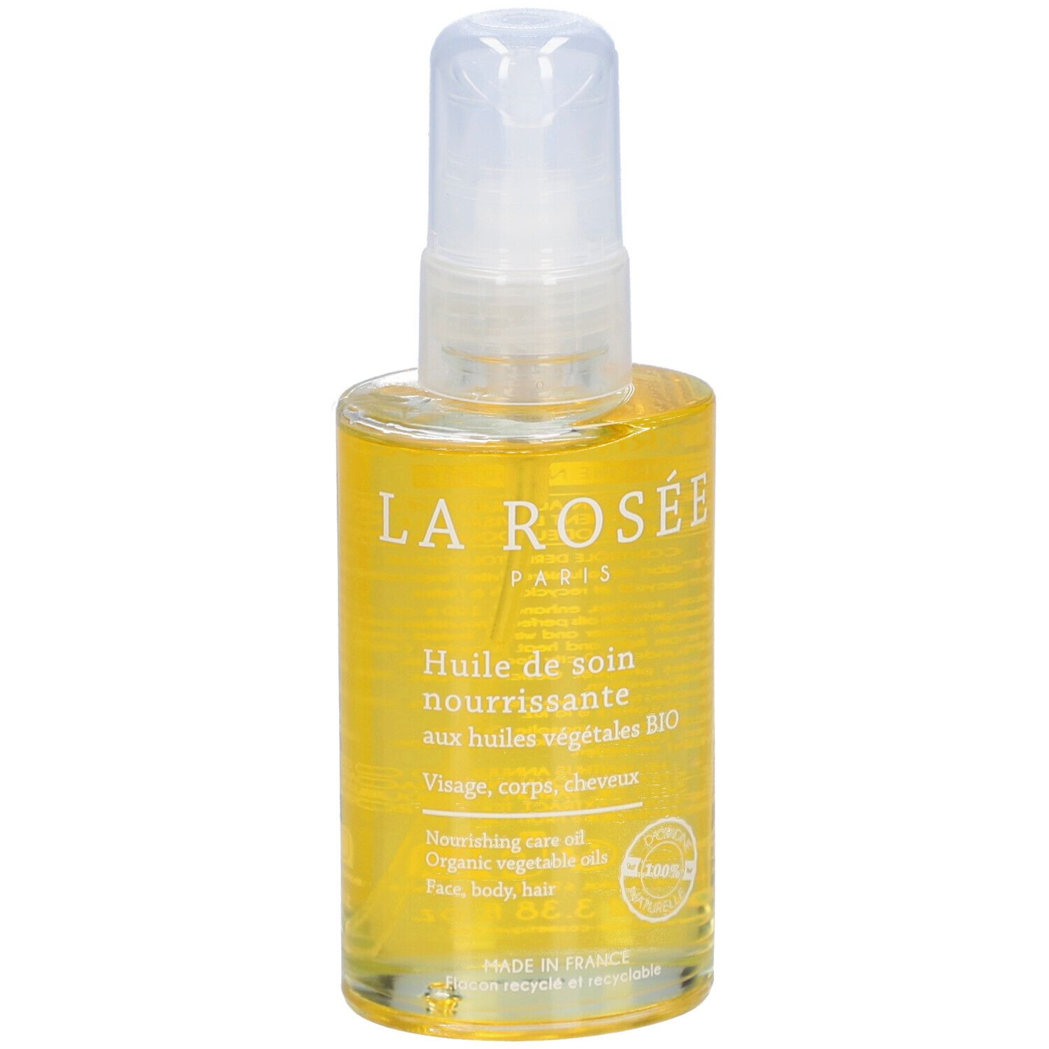 Flacon spray transparent contenant un liquide jaune. Inscription: LA ROSÉE PARIS, Huile de soin nourrissante, aux huiles végétales BIO.