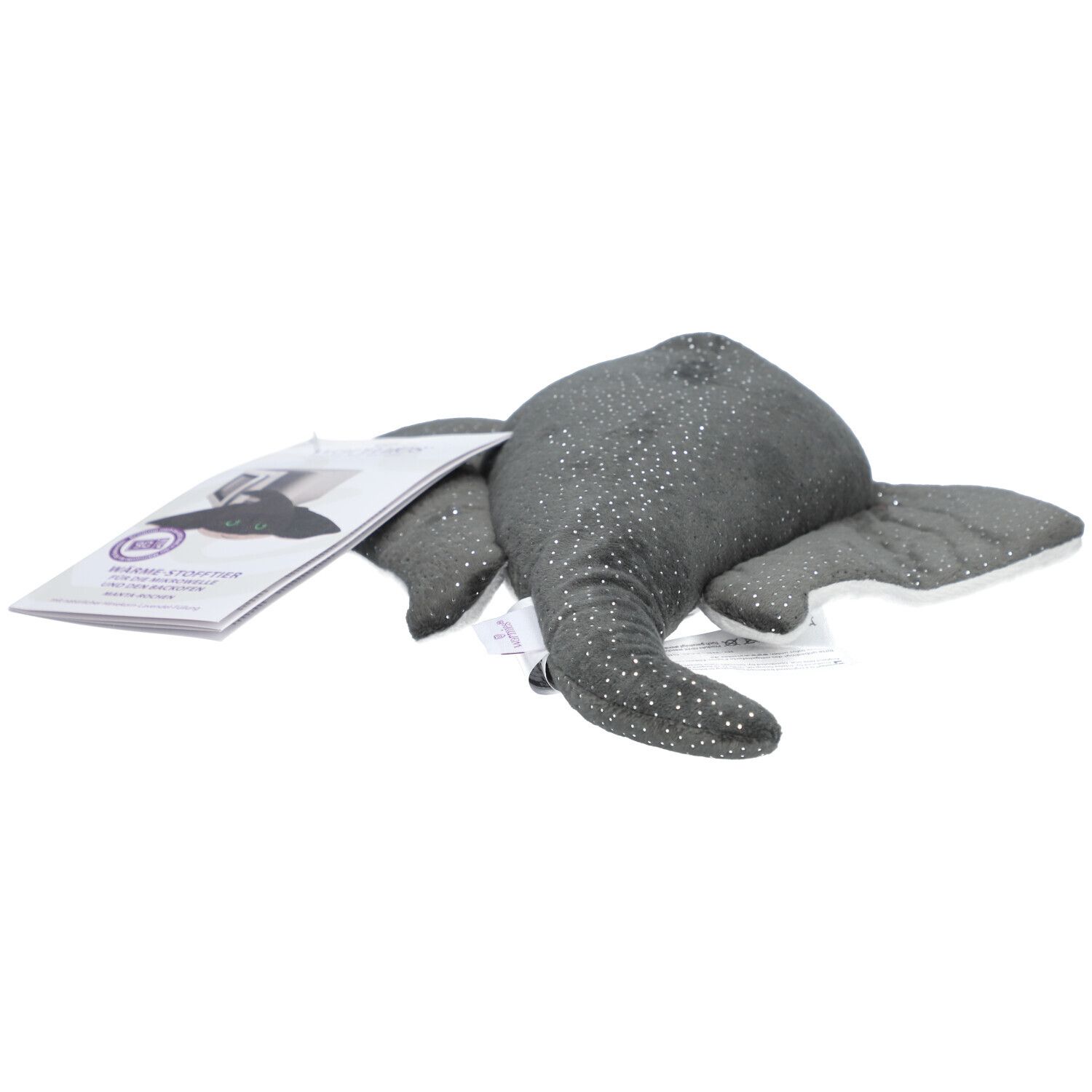 Raie manta en peluche grise à pois blancs et paillettes. Yeux verts. Étiquette avec logo.