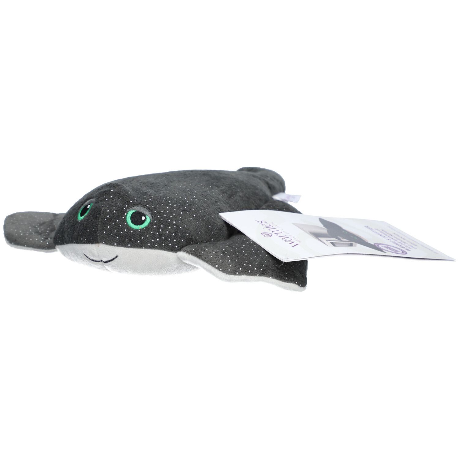 Raie manta en peluche grise à pois blancs et paillettes. Yeux verts. Étiquette avec logo.