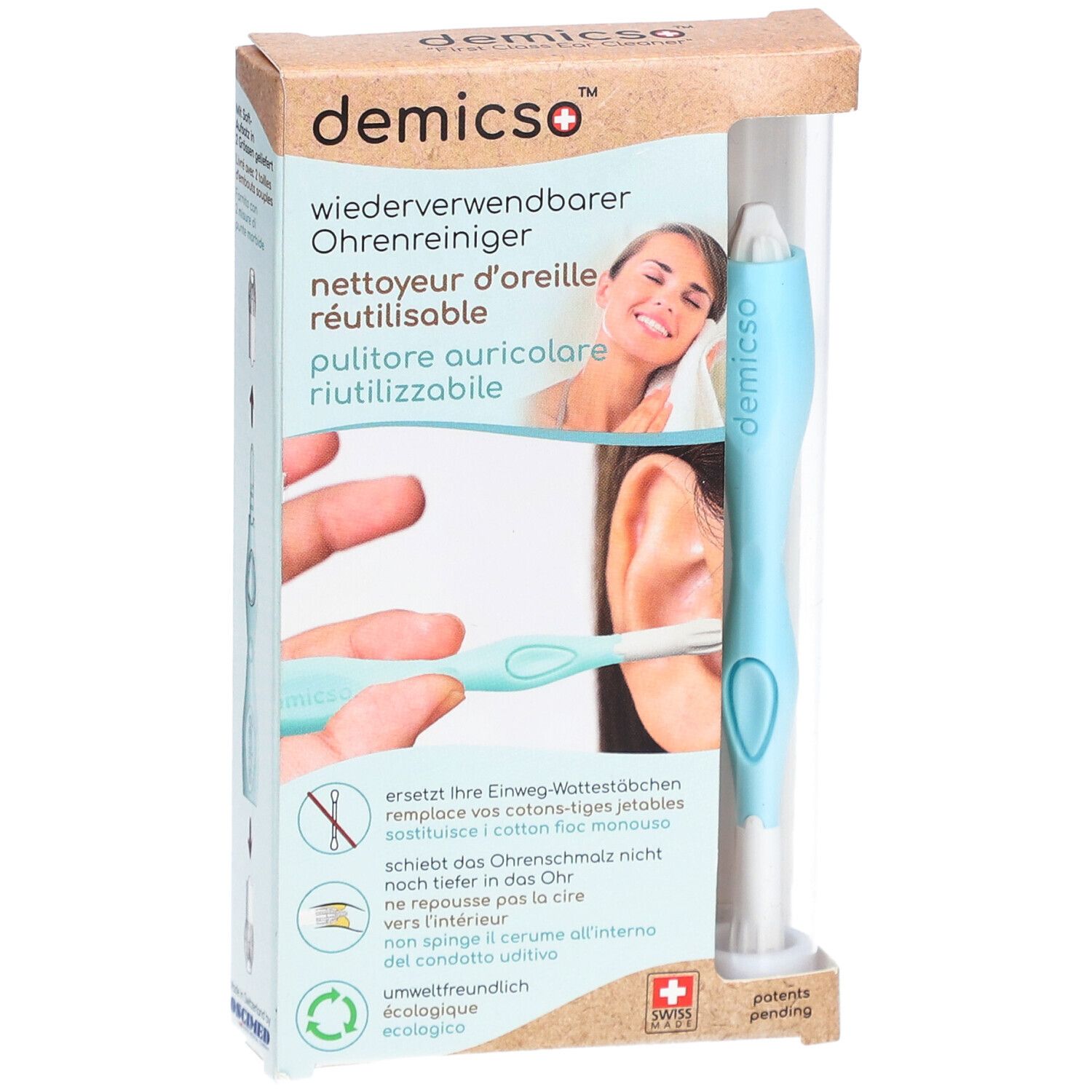 Oorreiniger in verpakking. Lichtblauwe handgreep, witte kop. Productnaam en logo zichtbaar. Transparante verpakking.