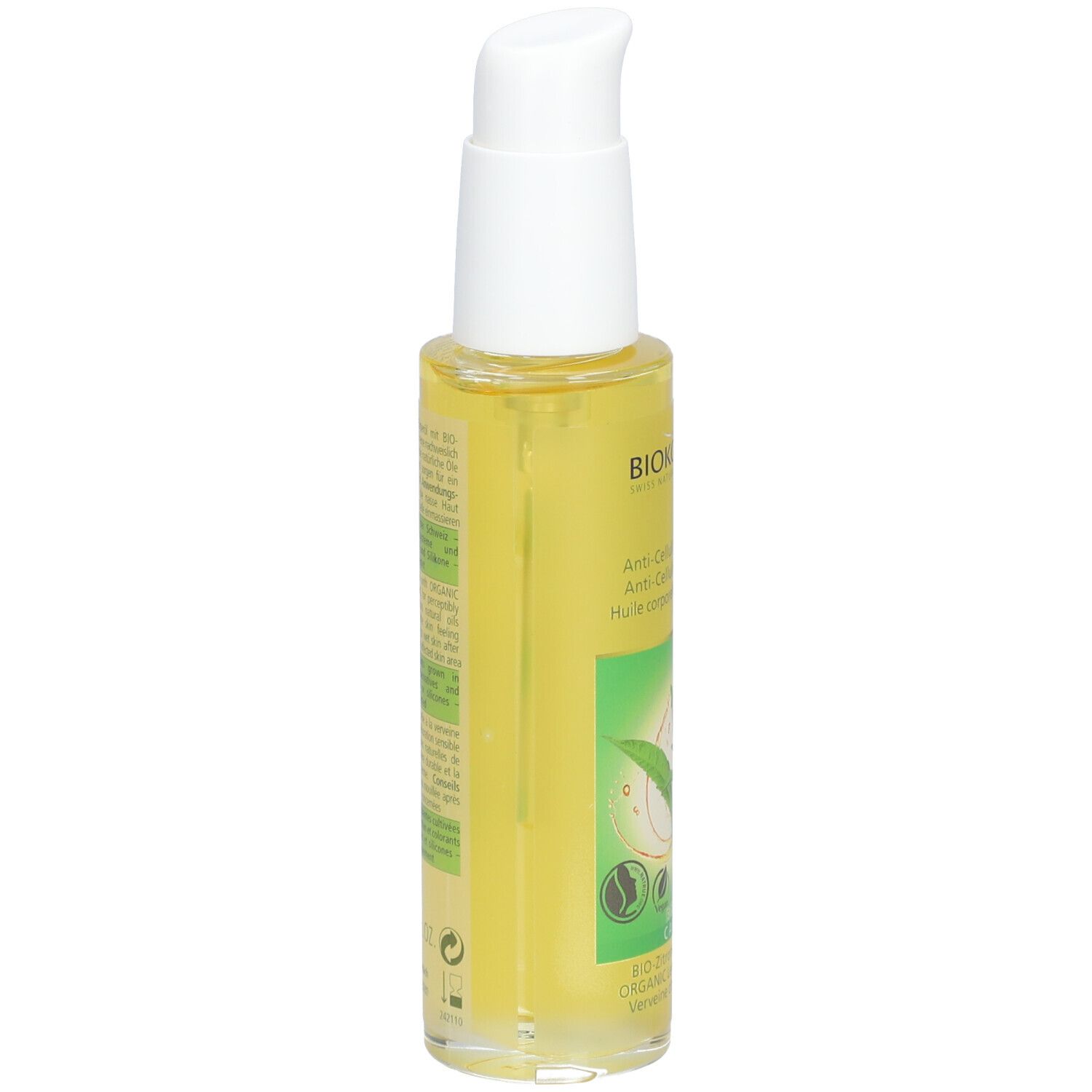 Gele fles met witte pomp. Opschrift BIOKOSMA, Anti-cellulite lichaamsolie. Groen-wit etiket met bladeren.