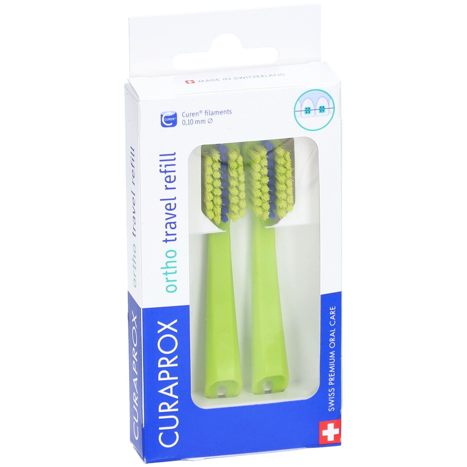 Twee groene opzetborstels in verpakking. Blauwe borstelharen. "CURAPROX" en "ortho travel refill" zichtbaar.