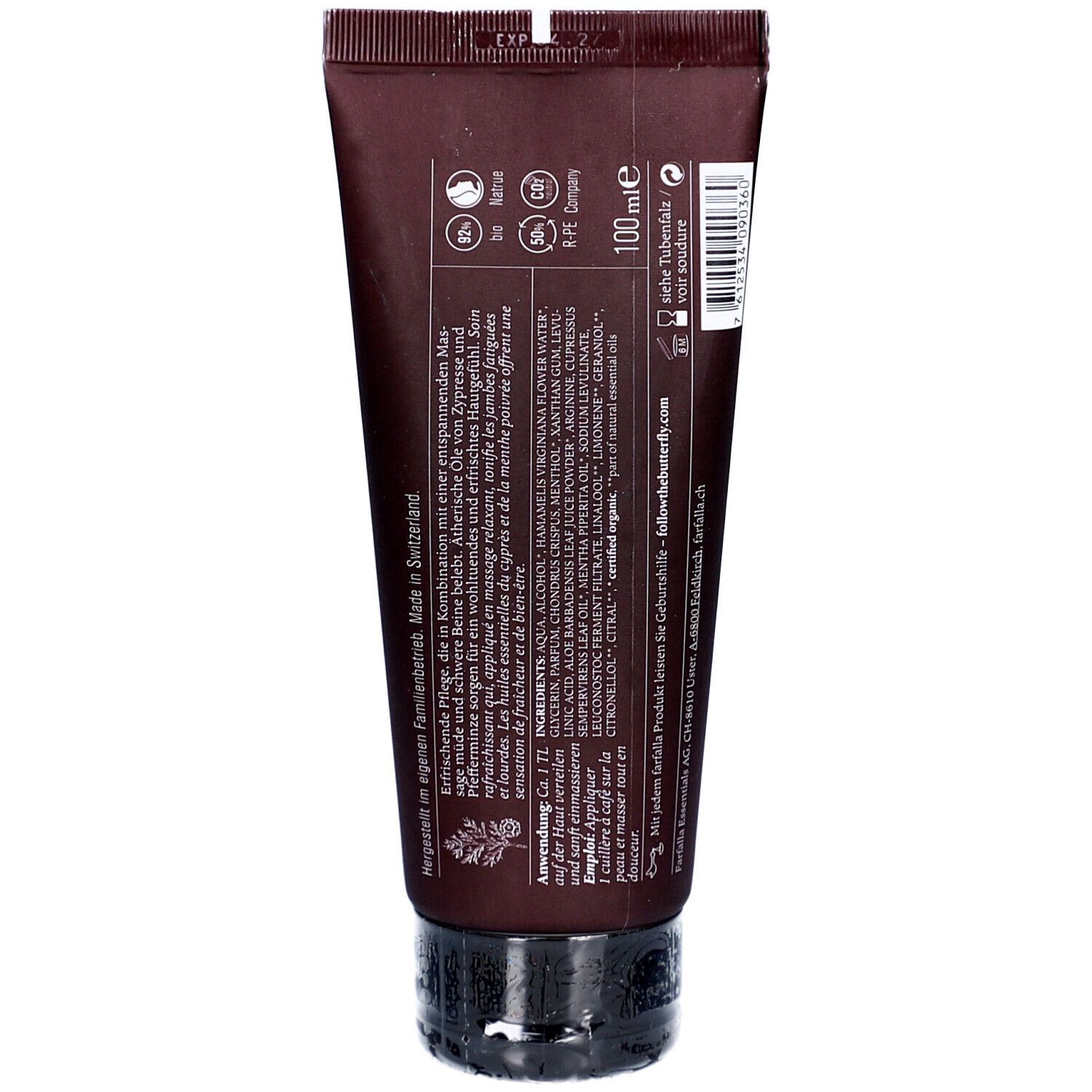 Achterkant van de bruine tube. Bevat informatie over ingrediënten, gebruik en fabrikant. Met '100 ml' indicatie.