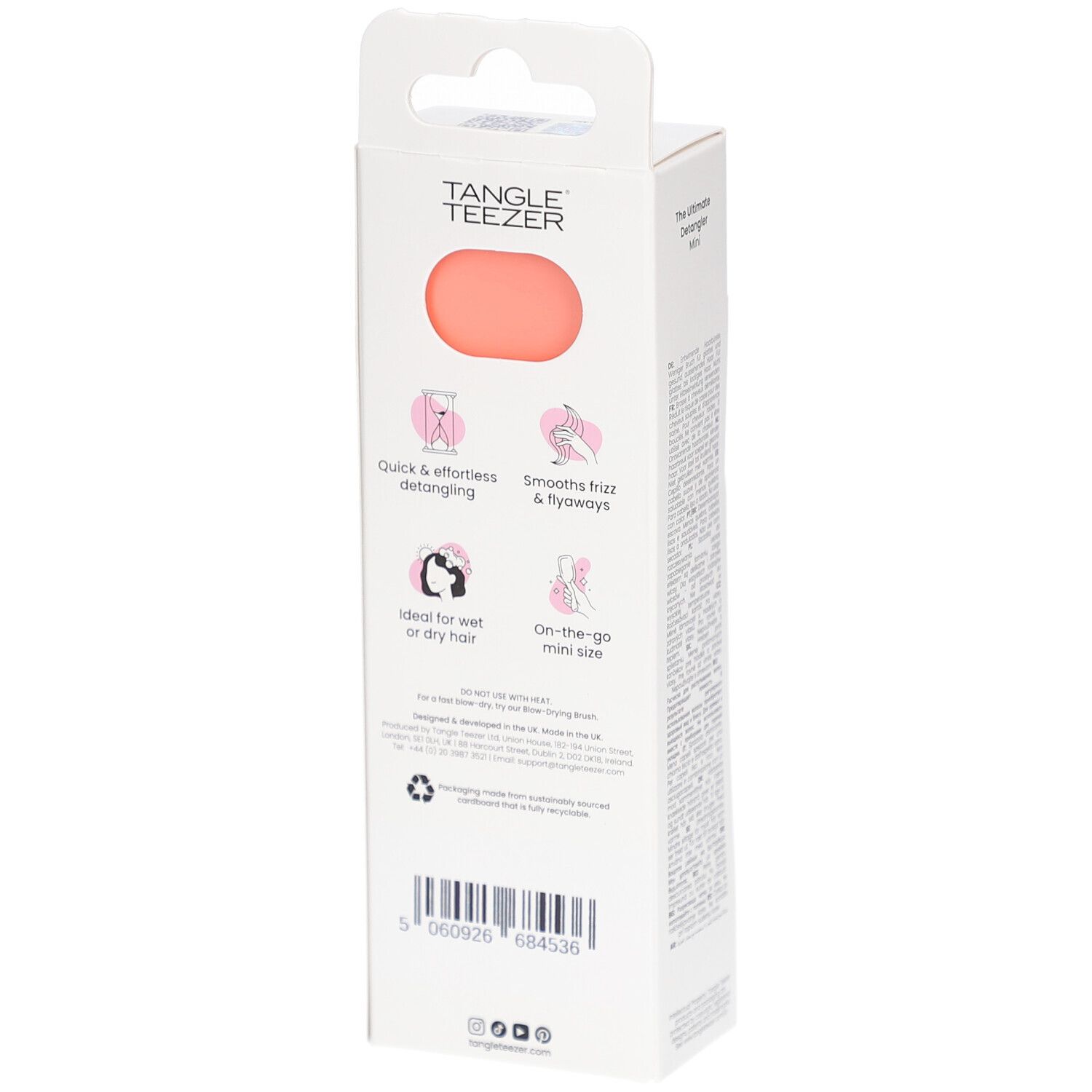 Achterkant van de TANGLE TEEZER Wet Detangler Mini verpakking. Roze en wit. Productinformatie en logo's.