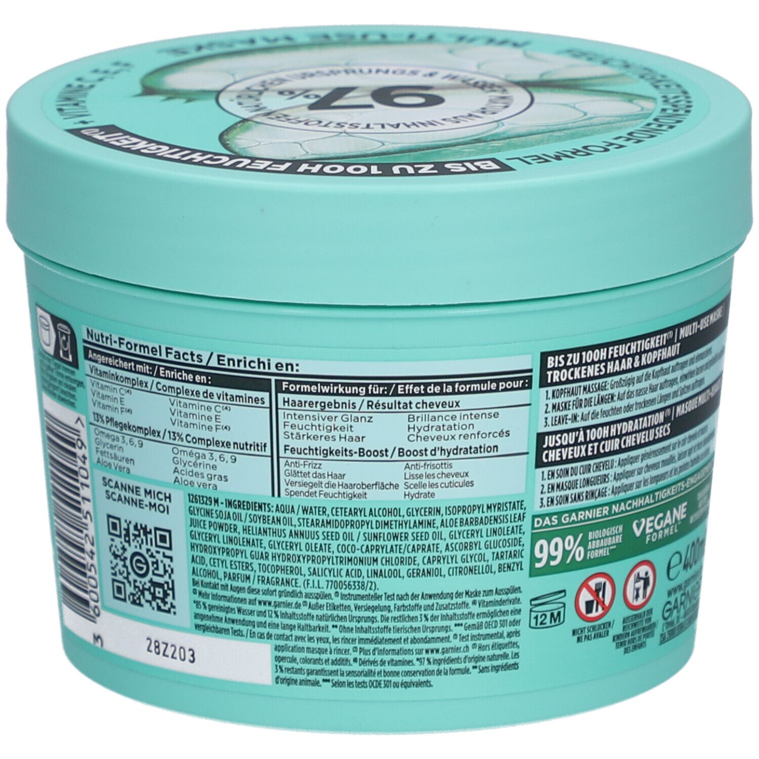 Pot turquoise, dos. Inscription: Garnier Fructis. Liste des ingrédients et instructions d'utilisation. Formule vegan. 400ml.
