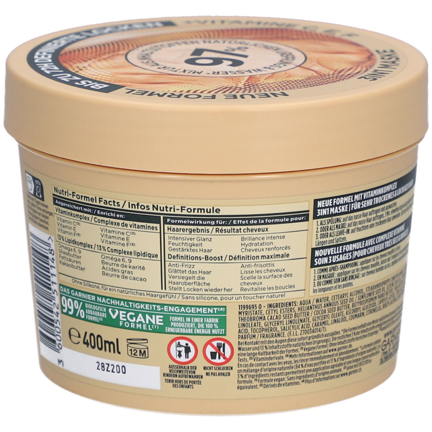 Beige pot Garnier Fructis Hair Food. Achterkant met ingrediënten en informatie. Vegan. 400ml. 99% ingrediënten van natuurlijke oorsprong.