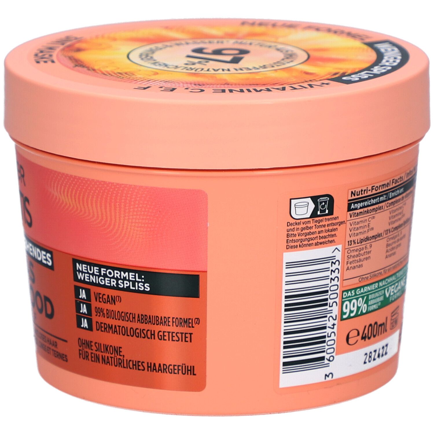 Ronde pot, achterkant, met tekst. Garnier Fructis Hair Food Ananas. Opschrift: Nieuwe formule, minder gespleten punten, 400ml.