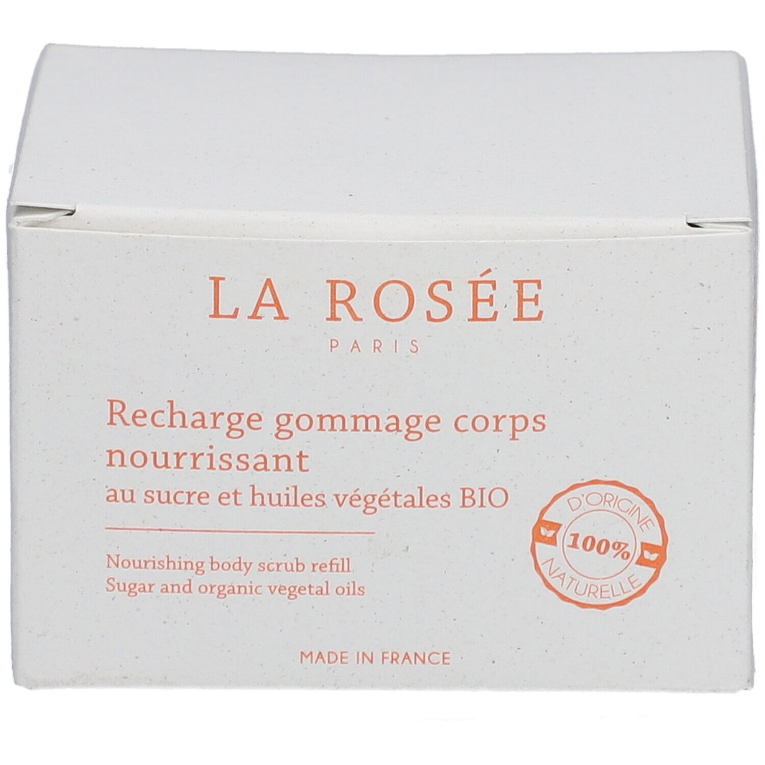 Boîte blanche avec informations produit. Inscription: LA ROSÉE, Recharge gommage corps nourrissant, au sucre et huiles végétales BIO.