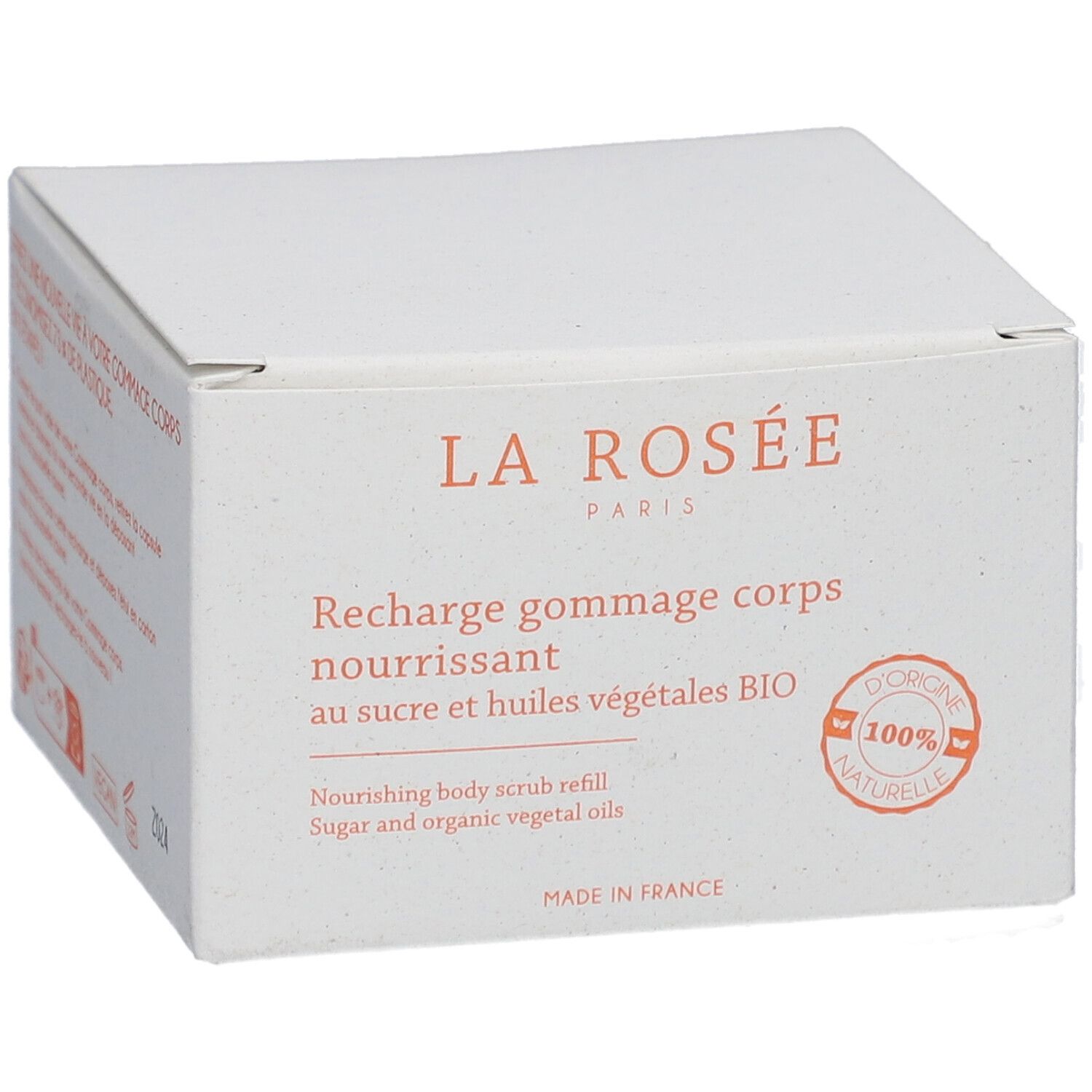 Boîte blanche avec informations produit. Inscription: LA ROSÉE, Recharge gommage corps nourrissant, au sucre et huiles végétales BIO.