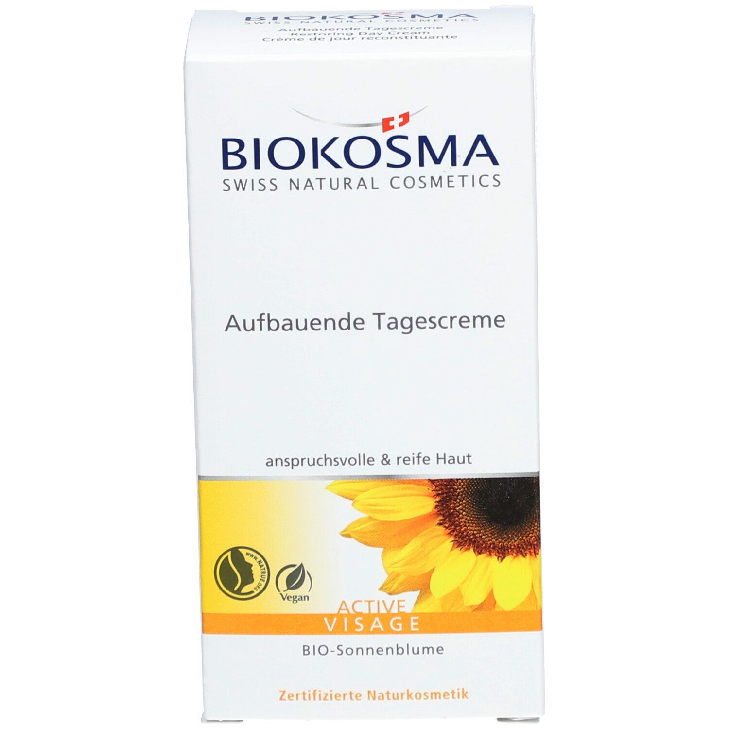Emballage de la crème de jour reconstituante BIOKOSMA Active Visage. Carton blanc. Inscription: Aufbauende Tagescreme, Crème de jour reconstituante. Vegan.