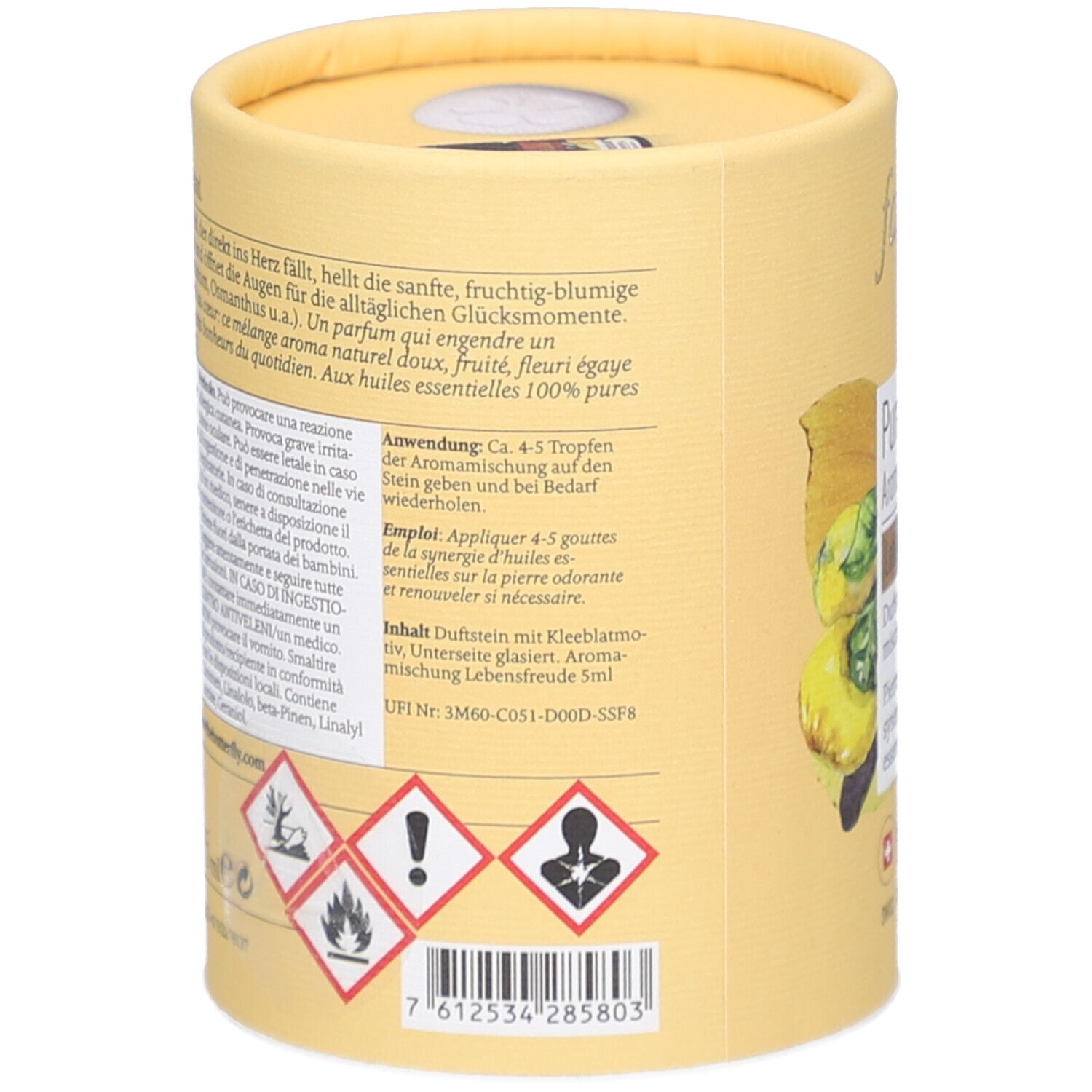 Achterkant cilindrische verpakking. Tekst over gebruik, ingrediënten, gevarenwaarschuwingen. Bevat geursteen met klavermotief. UFI-code en barcode.